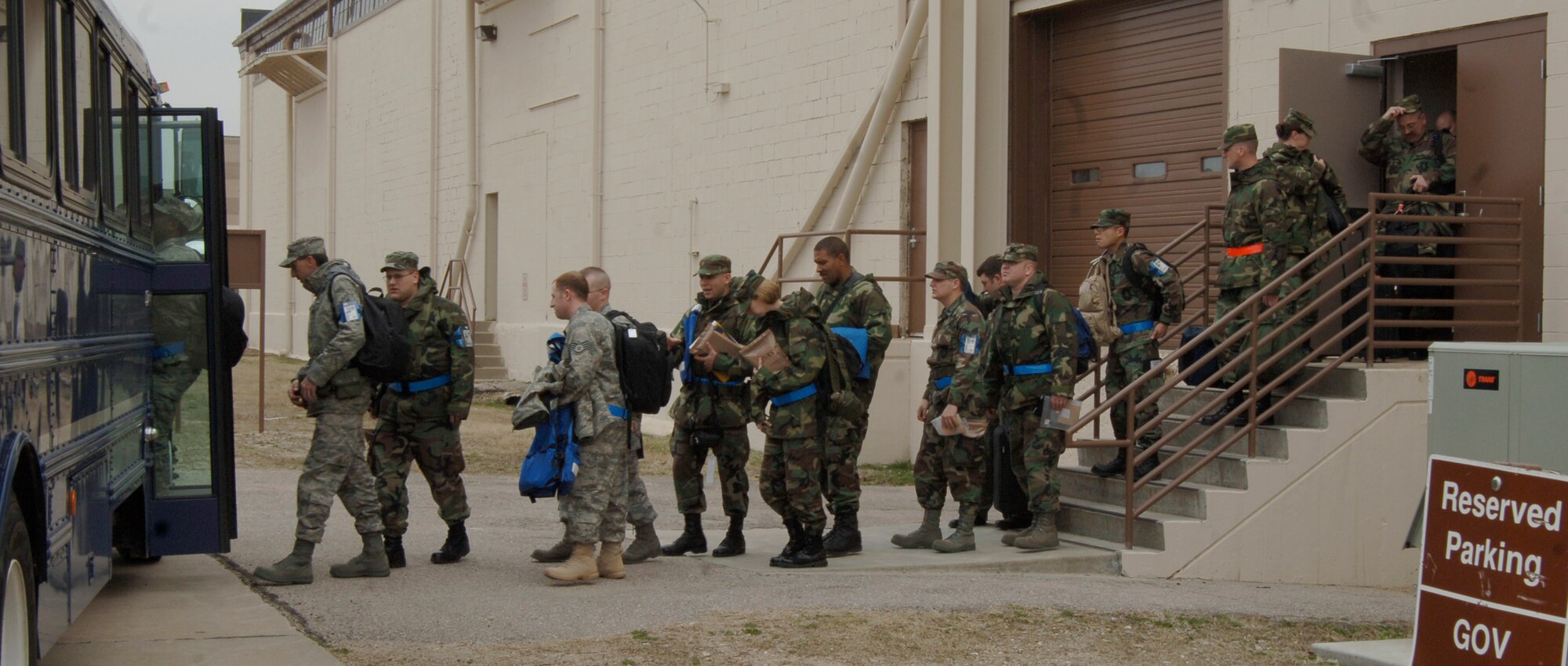 MCCONNELL AIR FORCE BASE, Kan. –- Team McConnell members depart the Passenger Terminal at Bldg. 1090, March 29, during an Operational Readiness Exercise that sent them to Volk Field Combat Readiness Training Center, Air National Guard Base, Wis. (Photo by Senior Airman Roy Lynch III)