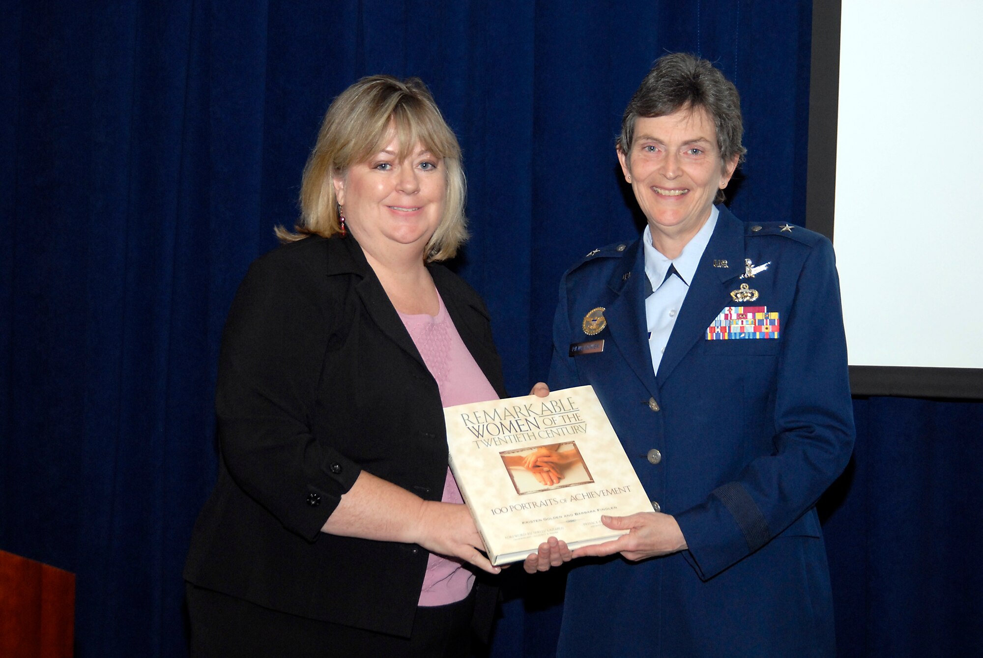 At the conclusion of the Women's History Month luncheon, SMC Vice Commander Brig. Gen. Pawlikowski was presented with a token of appreciation by Los Angeles AFB Federal Women's Program Manager Beverly Campbell.  (Photo by Joe Juarez)