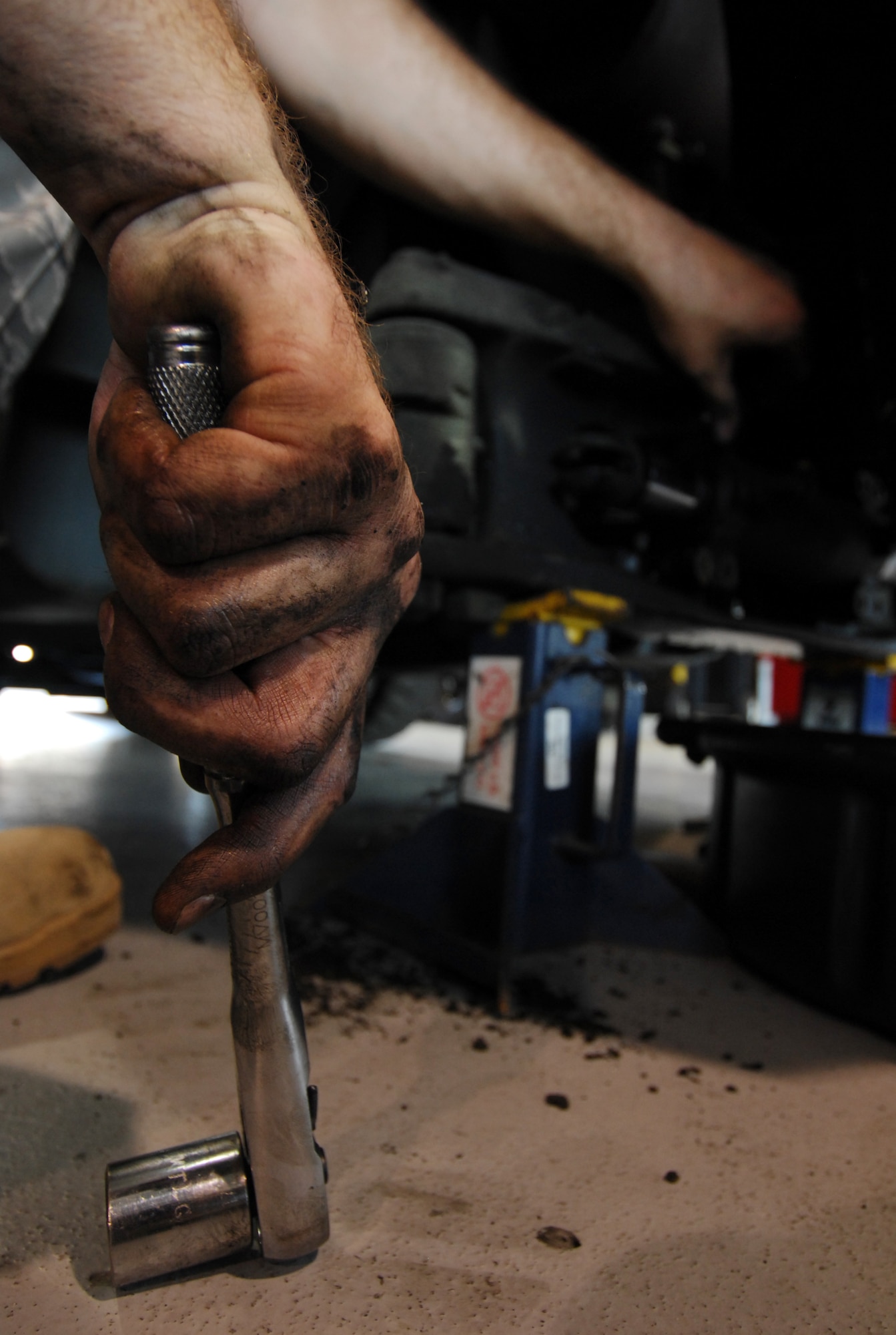 MOODY AIR FORCE BASE, Ga. -- Staff Sgt. Robert Styles, 23rd Logistics Readiness Squadron Vehicle Maintenance, uses a wrench to remove a leaking steering cylinder from a forklift here April 2. Sergeant Styles, NCO in-charge of fire-truck maintenance, often works on other projects like this forklift. (U.S. Air Force Photo/Staff Sgt. Joshua T. Jasper) 