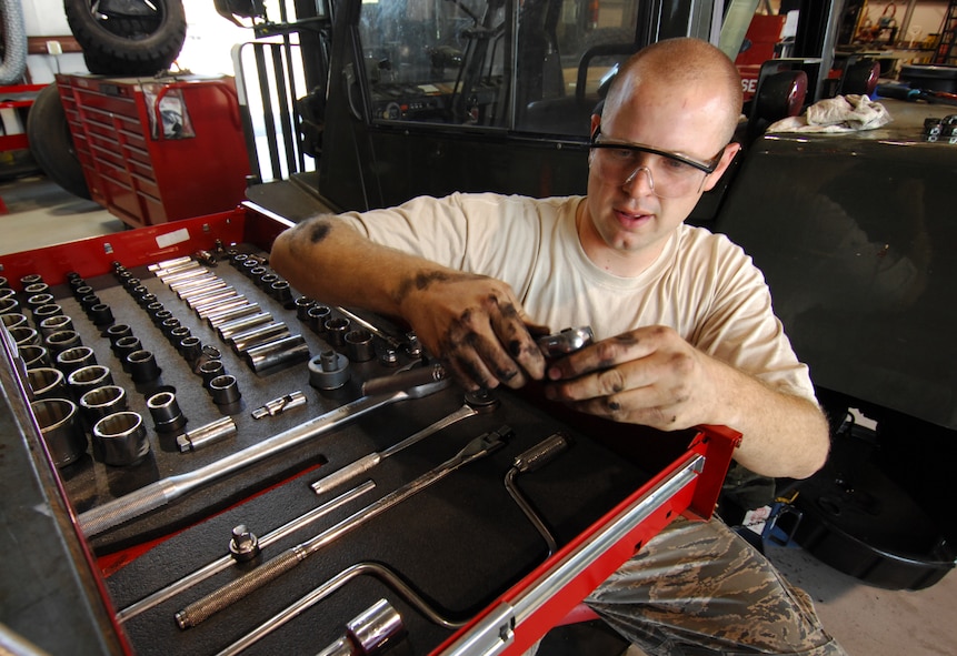 MOODY AIR FORCE BASE, Ga. -- Staff Sgt. Robert Styles, 23rd Logistics Readiness Squadron vehicle maintenance technician, removes parts from a forklift to remove and rebuild a leaking steering cylinder here April 2. Sergeant Styles is the NCO in-charge of Fire-truck Maintenance, but often takes on other projects such as this one. (U.S. Air Force Photo/Staff Sgt. Joshua T. Jasper) 