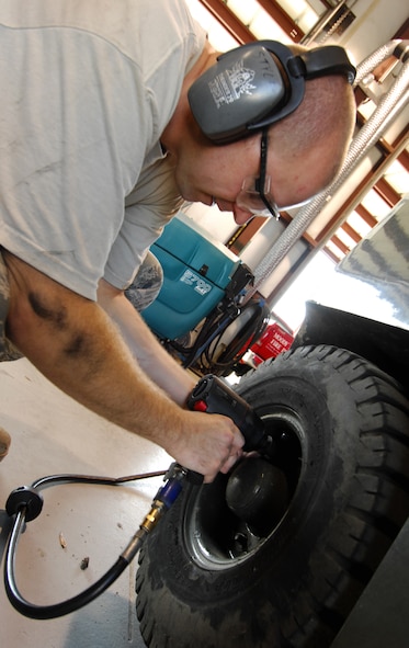 MOODY AIR FORCE BASE, Ga. -- Staff Sgt. Robert Styles, 23rd Logistics Readiness Squadron vehicle maintenance craftsman, removes the wheel from a forklift to rebuild its leaking steering system here April 2. Sergeant Styles is the NCO in-charge of fire-truck maintenance. (U.S. Air Force Photo/Staff Sgt. Joshua T. Jasper) 