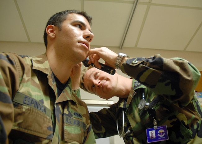 Airman 1st Class Jason Espinosa gets a check-up from Capt. Robert Toner at the 437th Medical Group Family Practice Wednesday. The 437 MDG provides world-class medical care to ensure Team Charleston members are able to accomplish the mission.  Captain Toner is a physician assistant with the 437th Medical Operations Squadron and Airman Espinosa is a hydraulic system apprentice with the 437th Aircraft Maintenance Squadron. (U.S. Air Force photo/Staff Sgt. Jennifer Arredondo)