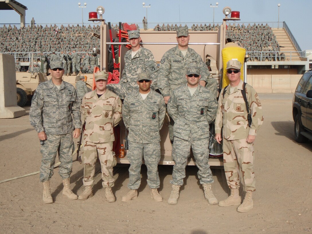 SEYMOUR JOHNSON AIR FORCE BASE, N.C. -- When Vice President Dick Cheney visited Balad, Iraq in March, reservists from the 916th Air Refueling Wing  were there to help with his arrival in their role as firefighters. In the picture; front left-right, SMSgt Scott Knuth, 916th Civil Engineer Squadron, A1C Adam Baumgardner, Malstrom AFB, A1C Matthew Kahai, Minot AFB, TSgt Chris McArdle 916th CES, Chief Doug Willis, 916th CES; back row left-right, Spc. James Taylor, 9th Ordinance Company, Fort Bragg NC, and SSgt Ben Frankenberry, Fairchild AFB. Vice President Cheney addressed more than 6,000 Airmen, Soldiers and Sailors during the visit.