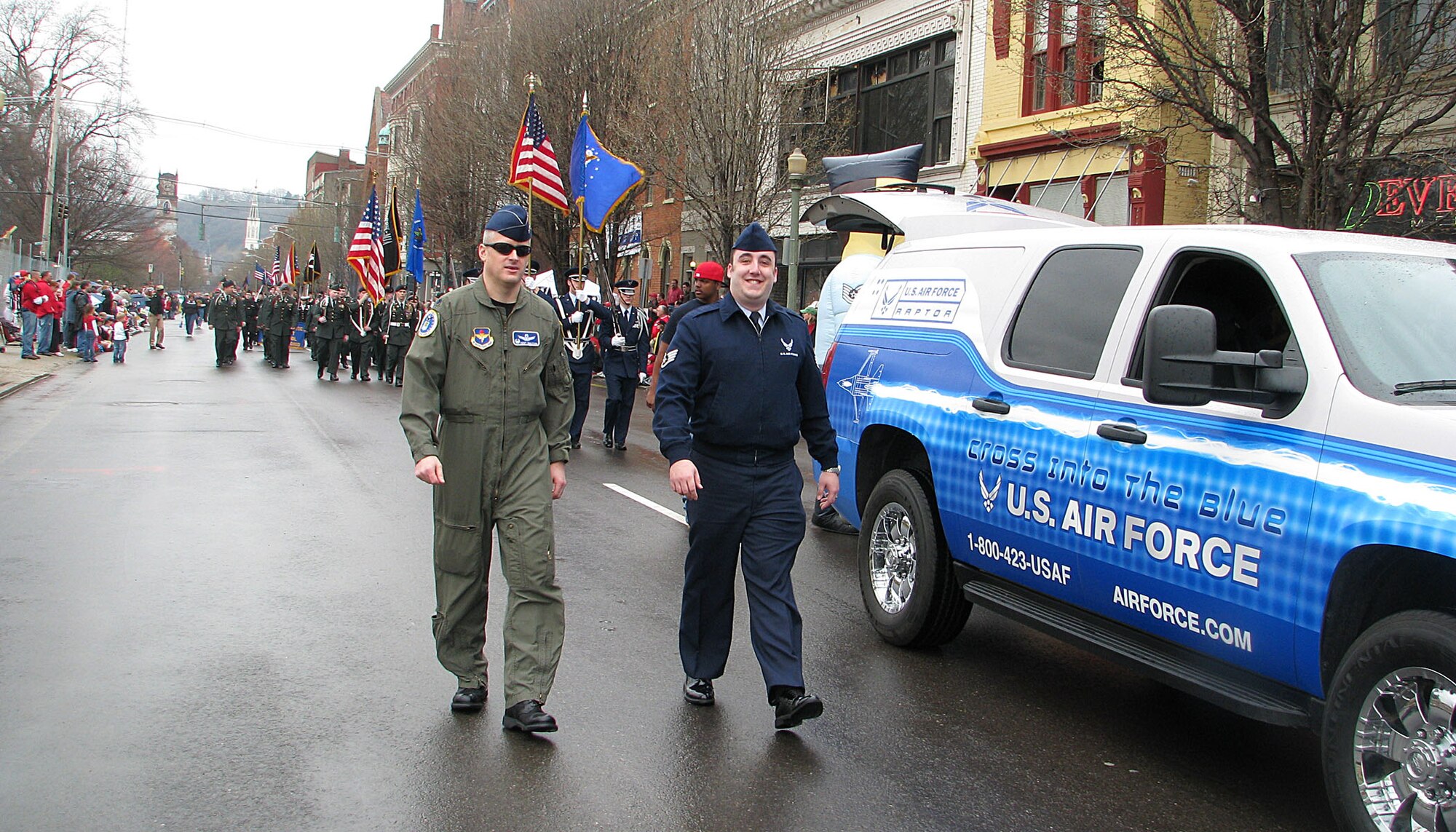 338th Recruiting Squadron Airmen march with U.S. Army Soldiers in the 89th annual Findlay Market Cincinnati Reds Opening Day Parade March 31. The parade followed a 15-block route through downtown Cincinnati drawing more then 20,000 spectators. (Staff Sgt. Chad Tanner)