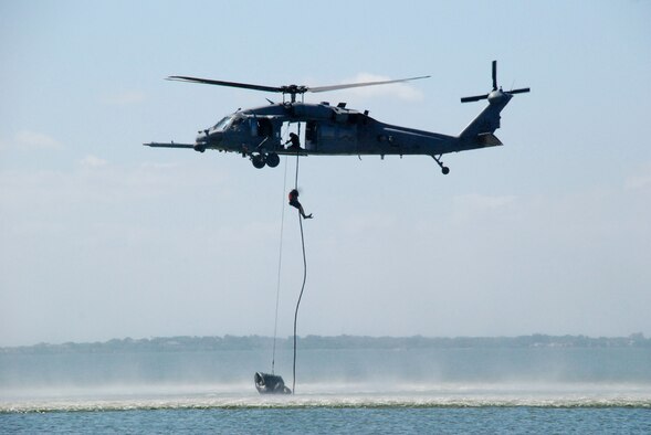 Rescue Reservists from the 920th Rescue Wing at Patrick Air Force Base, Fla. train for water rescue recovery on the Banana River which borders the base to the west.  They consistently train on the portion of the river called the Judy Drop Zone.  The pararescueman seen here is fast-roping from an HH-60G Pave Hawk helicopter piloted by aircrew from the wing's 301st Rescue Squadron.  The rescue crews use this technique to board ships at sea when there is a need for a rescue at sea.  The Pave Hawks have the ability to refuel while in flight which allows them to travel far distances out in the Ocean where ships set sail. (U.S. Air Force Photo/Ms. Jasmine DeNamur)