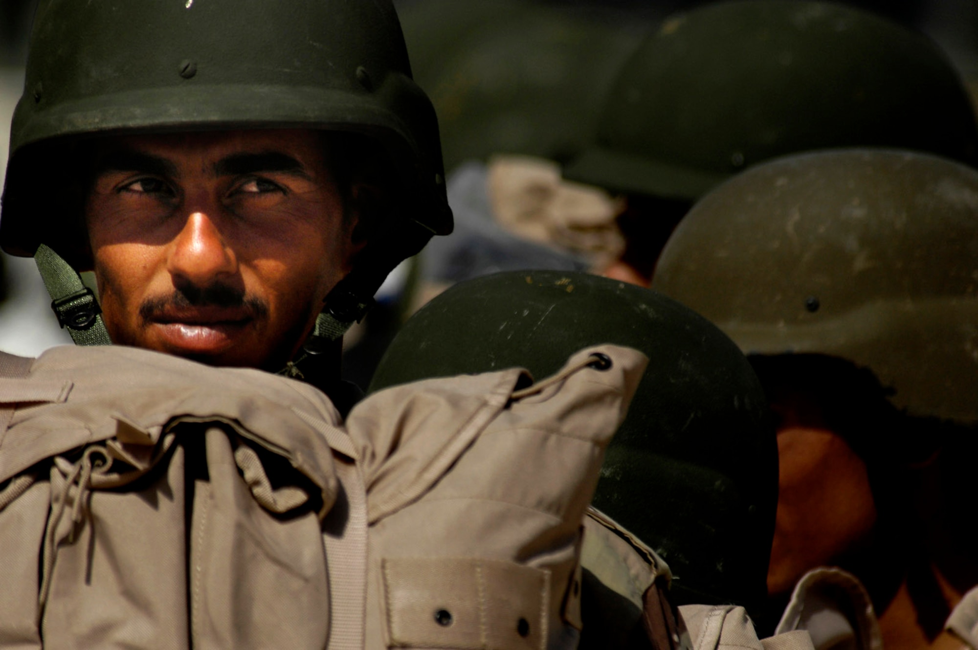 A member of the Iraqi army boards an Iraqi C-130 Hercules for a March 30 flight to Basra, Iraq, at New Al Muthana Air Base, Iraq. All processing, loading and transporting of the Iraqi troops is being conducted by the Iraqi air force. (U.S. Air Force photo/Tech. Sgt. Jeffrey Allen) 
