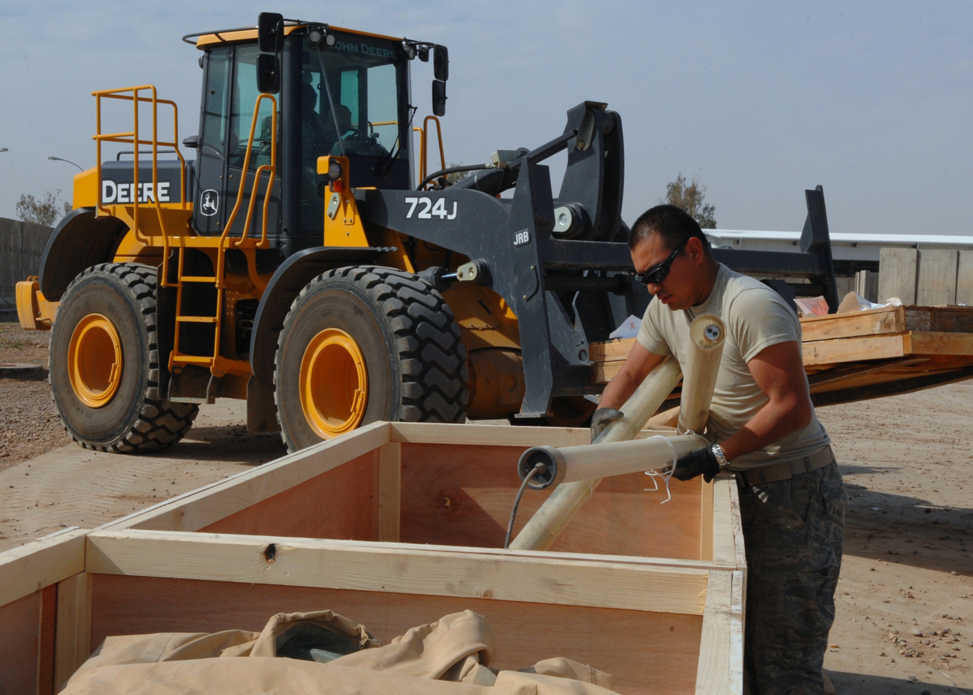 BALAD AIR BASE, Iraq -- Staff Sgt. Gabriel Lira, 332nd Expeditionary Civil Engineer Squadron structures craftsman, loads up lighting fixtures from the old Air Force Theater Hospital emergency room into a crate for shipment to the National Museum of Health and Medicine in Washington, D.C., here, Feb. 29. The tent is slated for exhibition because it is known, by the medical community, as the place where the most American blood was spilled since the Vietnam War. Sergeant Lira is deployed from Peterson Air Force Base, Colo. (U.S. Air Force photo/ Senior Airman Julianne Showalter)