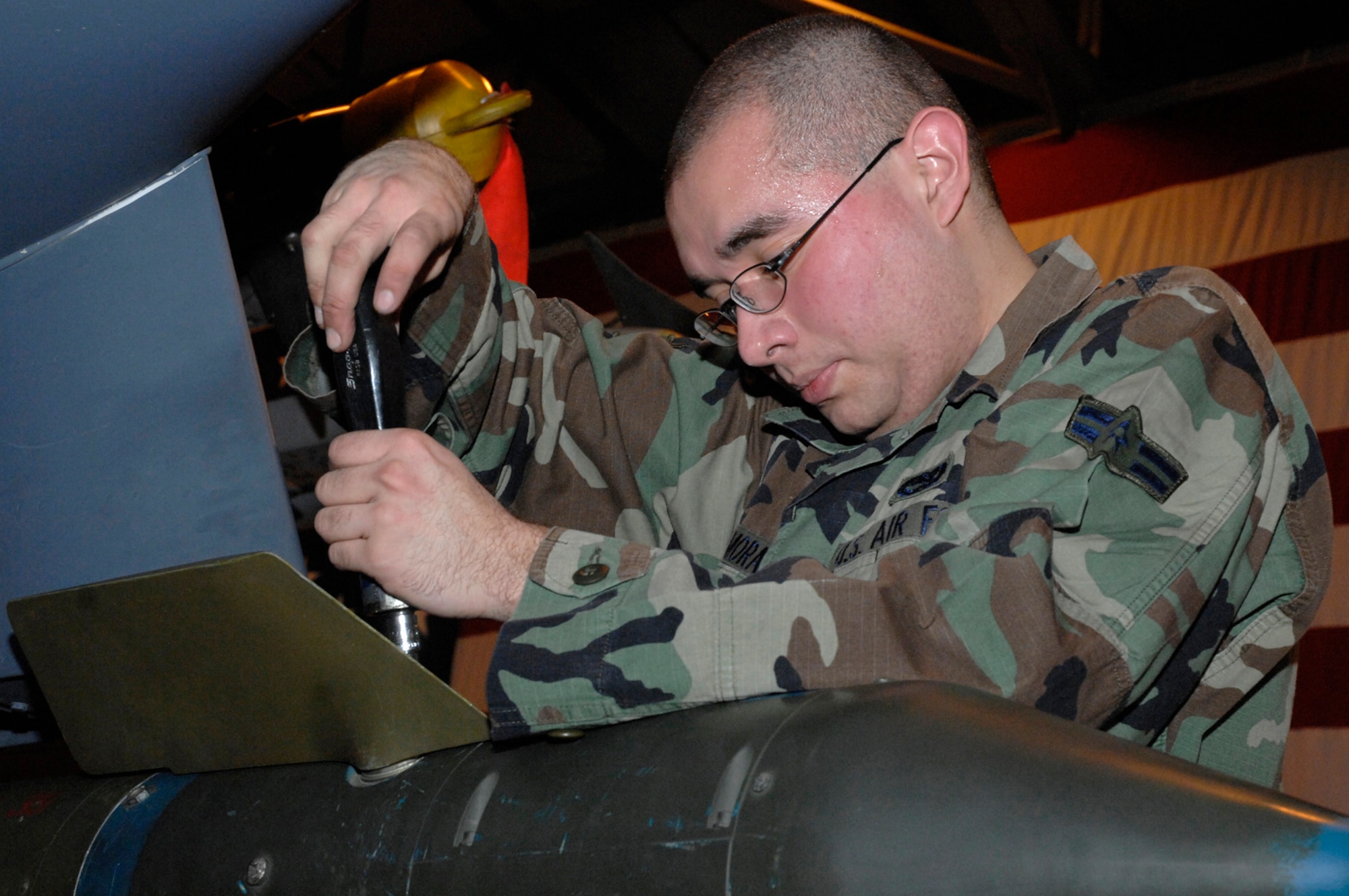 Airman 1st Class Erwin Zamora, 48th Aircraft Maintenance Squadron, attaches one of the front fins to a GBU-12 Bomb during the annual weapons load crew competition. March 14 at RAF Lakenheath. The competition is between the top 4 of the 47 weapons load crews. (U.S. Air Force photo by Airman Perry Aston)