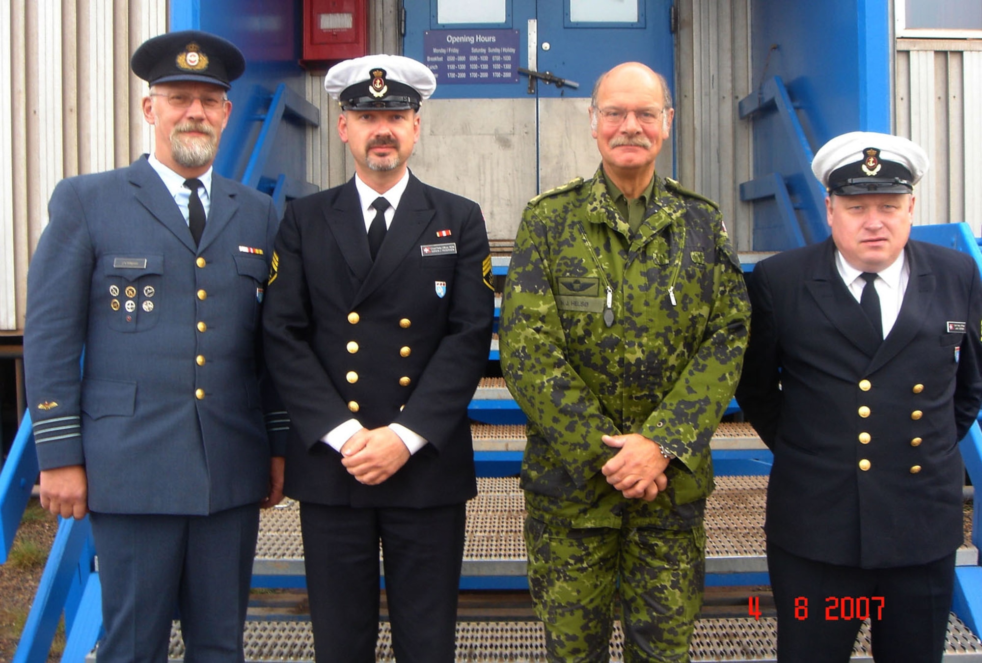 THULE AIR BASE, Greenland -- Lt. Col. John Blagreen, Danish Liaison Officer; Chief Petty Officer Soren Pederson, DLO staff; Gen. Hans Jesper Helso, Danish Chief of Defense; and Chief Petty Officer Lars Iversen, DLO staff, pose for a photo in August 2007 when General Helso and other Chiefs of Defense visited Thule Air Base. (U.S. Air Force photo)
