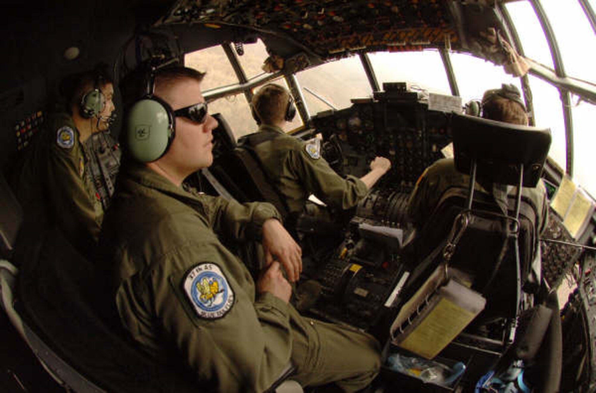 Flying a tactical sortie of eastern Bulgaria, C-130E Flight Engineer Staff Sgt. Jeremy Lynn and 1Lt. Ryan Donohoe provide an extra set of eyes for pilots Captain's Chris Dorough and  Matt Laurentz  during Exercise Thracian Spring 2008. Four Hercules from the 37th Air Lift Squadron and approximately 170 aircrew and support personnel assigned to the 86th Air Lift Wing and 435th Air Base Wing at Ramstein Air Base, Germany are being hosted by the Bulgarian military for the annual bilateral training exercise between the United States and Bulgaria. Photo by Master Sgt. Scott Wagers / (released)

