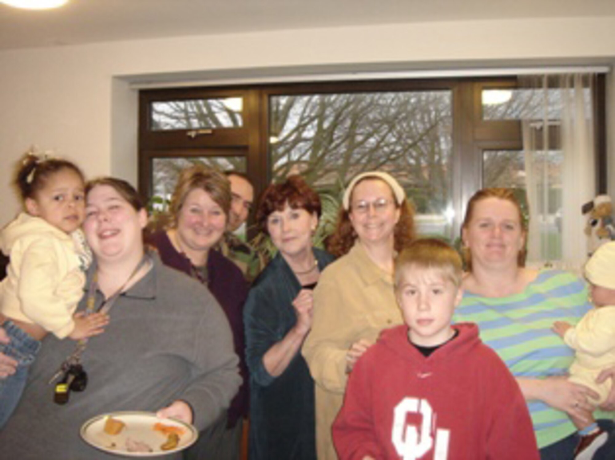 The RAF Alconbury Airman and Family Readiness Center hosts a Hearts Apart "themed" pot luck dinner on the last Thursday of each month for family members of deployed personnel.  Kellie Gray, along with daughter Samantha and son Dennis, enjoy dinner with Sonya Hill, joined by son Jacob, at the March Hearts Apart "German" pot luck dinner in March.  Both of their spouses are deployed in support of Operations Iraqi and Enduring Freedom. (U.S. Air Force photo)