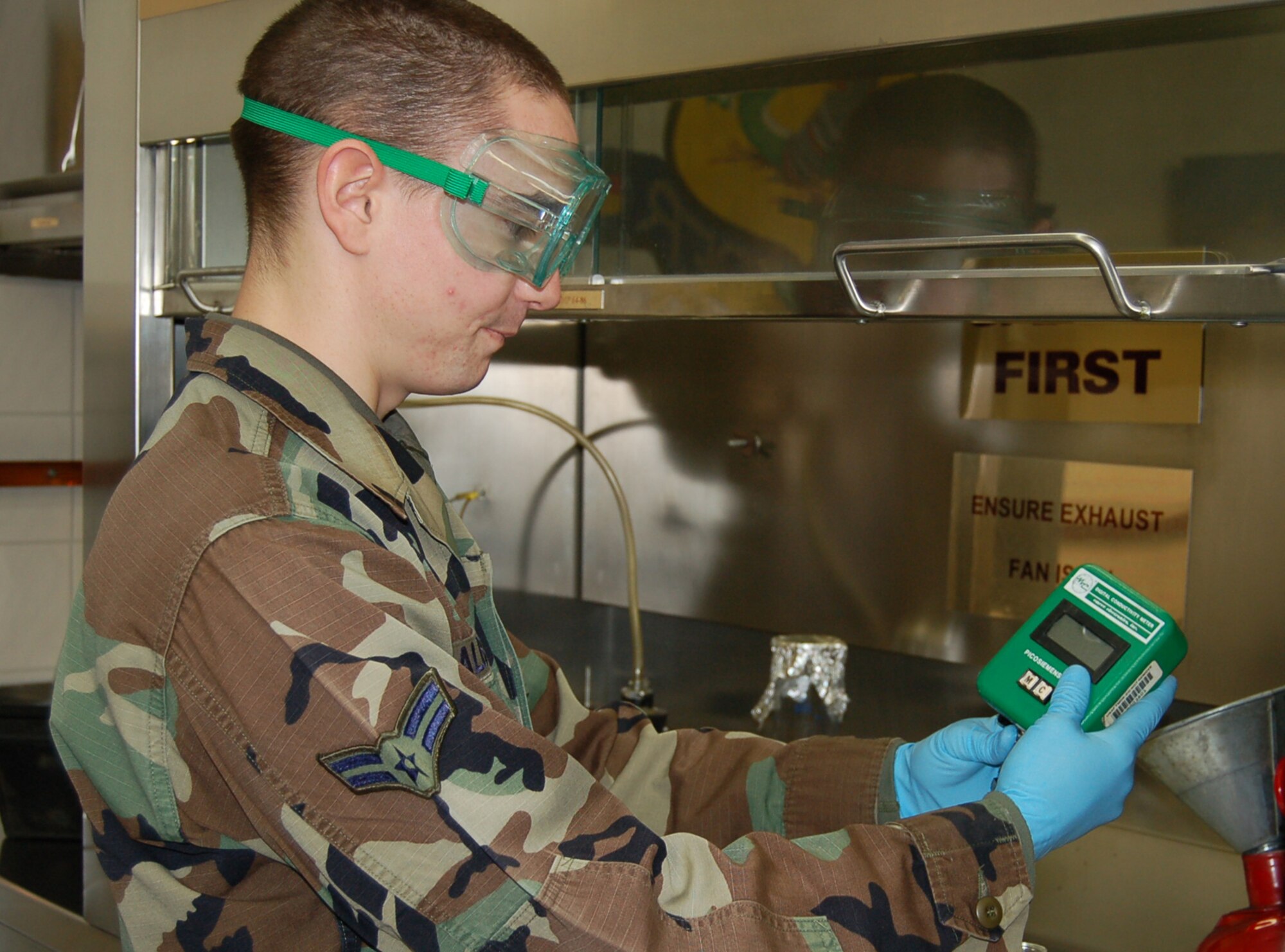 SPANGDAHLEM AIR BASE, Germany – Airman 1st Class Darren Albrecht, 52nd Logistics Readiness Squadron fuel laboratory technician, checks the conductivity additive level in a fuel sample. The additive decreases the conductivity of the fuel making it safer to handle.  (U.S. Air Force photo/Staff Sgt. Tammie Moore)