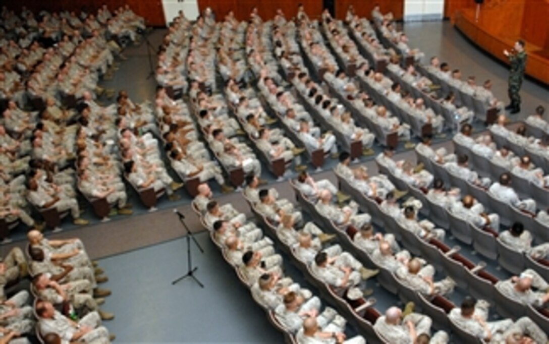 Chairman of the Joint Chiefs of Staff Navy Adm. Mike Mullen speaks with senior-ranking sailors and Marines at the base theater on Camp Lejeune, N.C., April 1, 2008. Mullen spent time answering questions and passing out coins to servicemembers. 