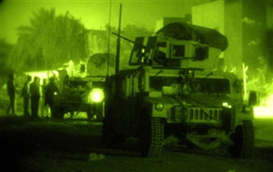 U.S. soldiers investigate a checkpoint during a patrol in Karadah, Iraq, March 20, 2008. They are assigned to 5th Battalion, 25th Field Artillery Regiment, 4th Brigade Combat Team, 10th Mountain Division.
 