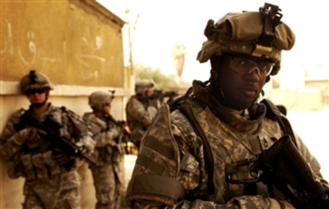 U.S. Army Sgt. 1st Class Darrell Webster provides security outside the Al-Alwya power station in Karadah, Iraq, March 19, 2008. Webster is with the 5th Battalion, 25th Field Artillery Regiment, 4th Brigade Combat Team, 10th Mountain Division. 