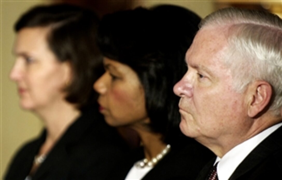 U.S. Ambassador to NATO Victoria Nuland, Secretary of State Condoleezza Rice and Defense Secretary Robert M. Gates look on during a speech by President George W. Bush at the kickoff of the Bucharest NATO Summit in Romania, April 2, 2008. 