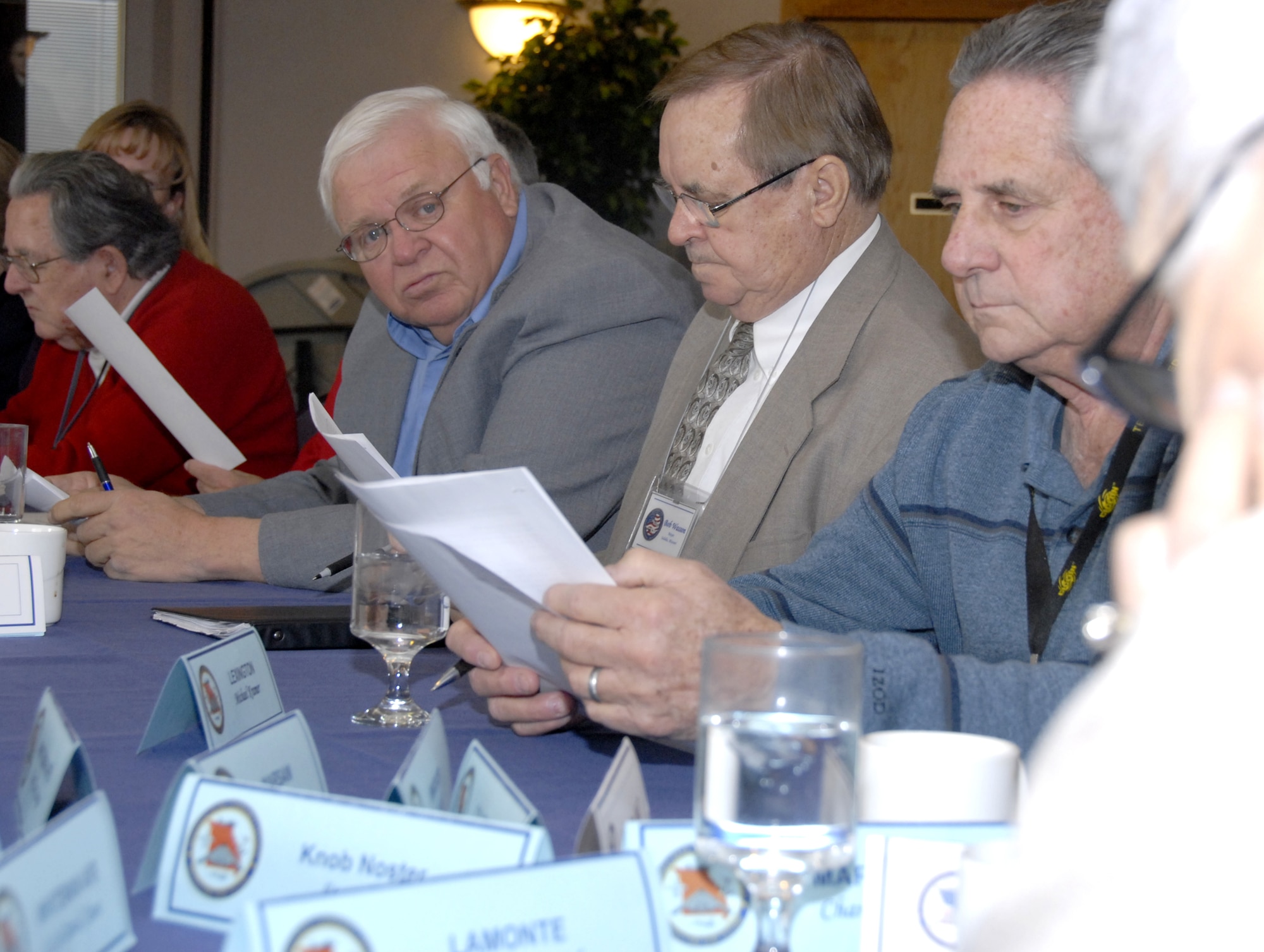 WHITEMAN AIR FORCE BASE, Mo. -- Left to right, Mr. Frank Sprinkles, Whiteman Base Community Council member from Sedalia, Mo.; Mr. Bob Wasson, mayor of Sedalia; and Mr. Michael Kramer, BCC member from Lexington, Mo., listen to a report by Ms. Betty McDaniel, BCC member from La Monte, Mo., March 6. The BCC executive board meets monthly to discuss base activities, needs and how they can better support Whiteman's active Guard and Reserve Airmen. The organization is one of four local civic groups whose charters are to support the base, its Airmen and military families. (US Air Force photo/Maj. David Kurle)