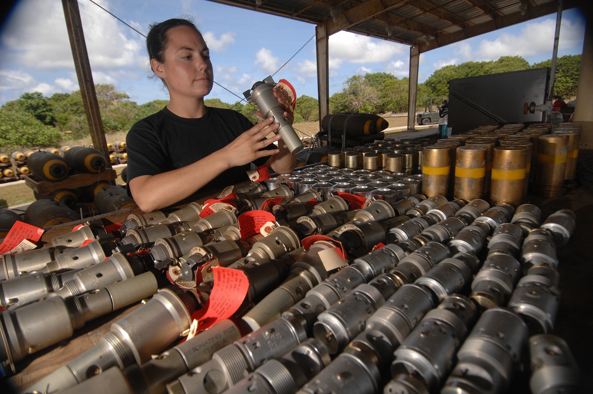 Andersen Air Force Base, Guam - Senior Airman Julia Unsworth inspects M904 nose fuzes before inserting them into M117 bombs. The 36th Munitions Squadron is building 270 free-fall, unguided, general purpose 750-pound M117 bombs that will eventually be loaded on a B-52 Stratofortress jet. In a conventional conflict, the B-52 can carry nuclear or precision guided conventional ordnance with worldwide precision navigation capability. SrA Unsworth is deployed from the 2nd Maintenance Group from Barksdale AFB, La. 
(U.S. Air Force photo/Staff Sgt. Vanessa Valentine)
