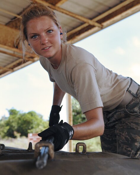 Andersen Air Force Base, Guam -- Airman First Class Casey Carrano loads several M117 bombs on a truck for transportation. The 36th Munitions Squadron is building 270 free-fall, unguided, general purpose 750-pound M117 bombs that will eventually be loaded on a B-52 Stratofortress jet. In a conventional conflict, the B-52 can carry nuclear or precision guided conventional ordnance with worldwide precision navigation capability. A1C Carrano is with the 36th Munitions Squadron.(U.S. Air Force photo/Staff Sgt. Vanessa Valentine)