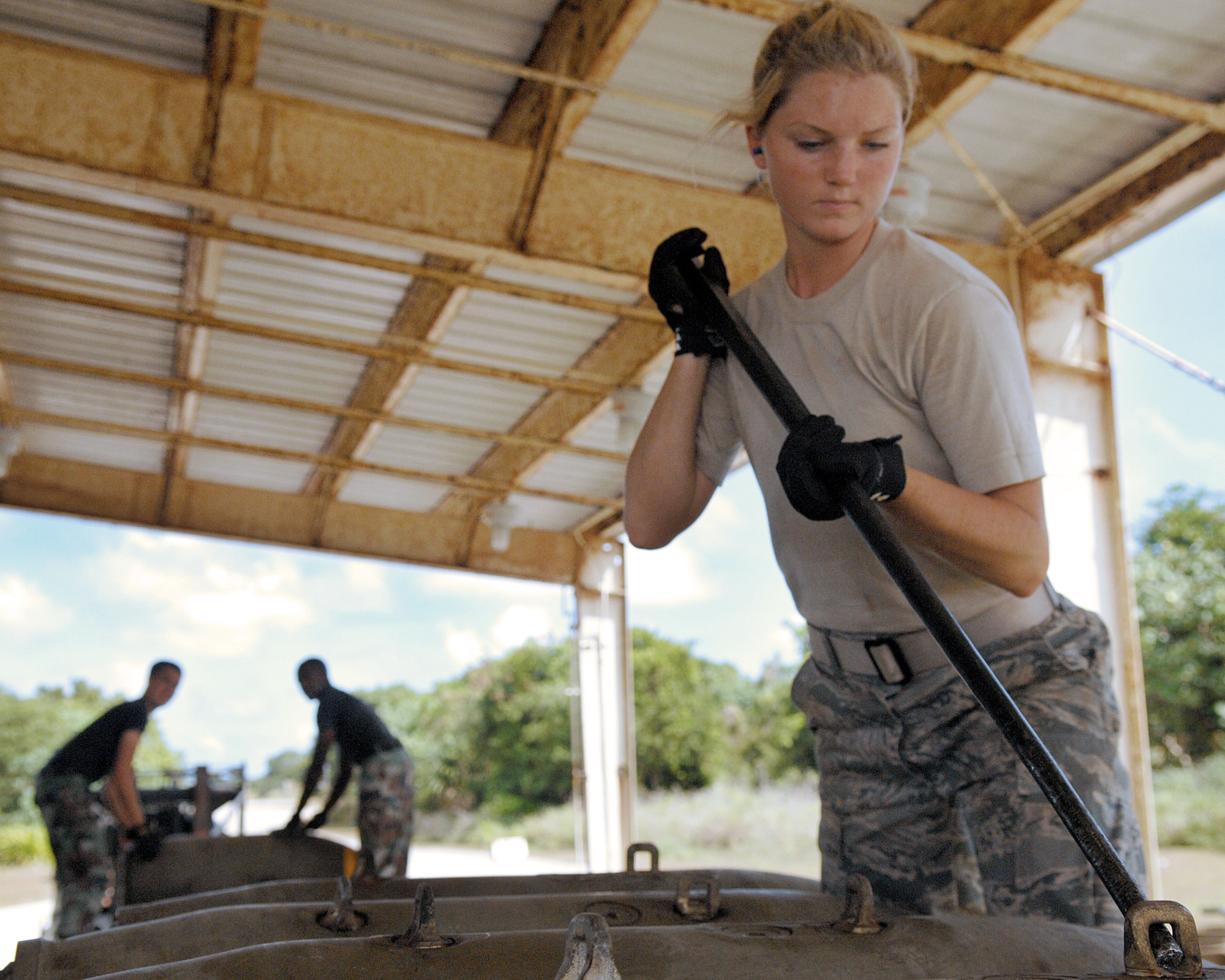 Andersen Air Force Base, Guam -- Airman First Class Casey Carrano loads several M117 bombs on a truck for transportation. The 36th Munitions Squadron is building 270 free-fall, unguided, general purpose 750-pound M117 bombs that will eventually be loaded on a B-52 Stratofortress jet. In a conventional conflict, the B-52 can carry nuclear or precision guided conventional ordnance with worldwide precision navigation capability. A1C Carrano is with the 36th Munitions Squadron.
(U.S. Air Force photo/Staff Sgt. Vanessa Valentine)
