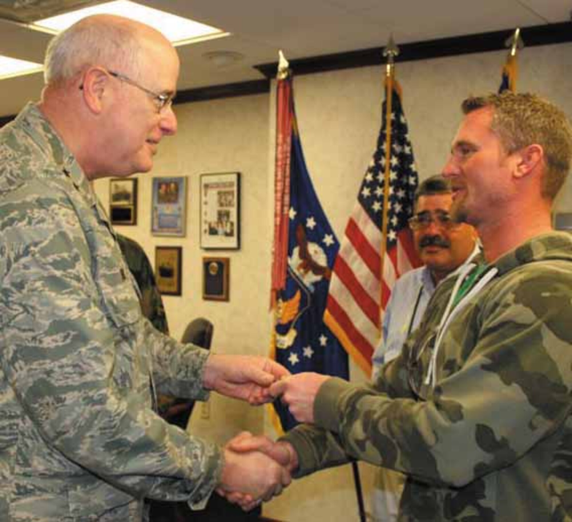 Jack Heard, 552nd Commodities Maintenance Squadron, was recently recognized for doing good by Maj. Gen. Loren Reno, Oklahoma City Air Logistics Center Commander.  Mr. Heard, an aircraft tool maker, was driving a Kawasaki Red Mule back to Bldg. 3001 from working a job at Bldg. 240.  When his government cell phone rang, Mr. Heard pulled over to take the call.  General Reno witnessed this take place and wanted to recognize Mr. Heard for abiding by the "no cell phone use while driving" policy