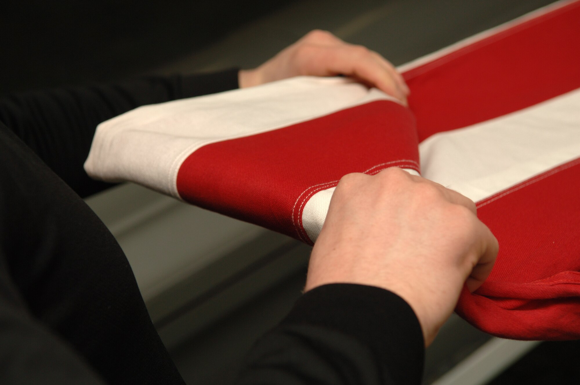 FAIRCHILD AIR FORCE BASE, Wash. – The flag fold is practiced regularly by each member of the Base Honor Guard here. A perfect fold is made with a lot of practice and a little luck, but is an expected accomplishment during each ceremony the Honor Guard attends. (U.S. Air Force photo / Senior Airman Jocelyn Ford)