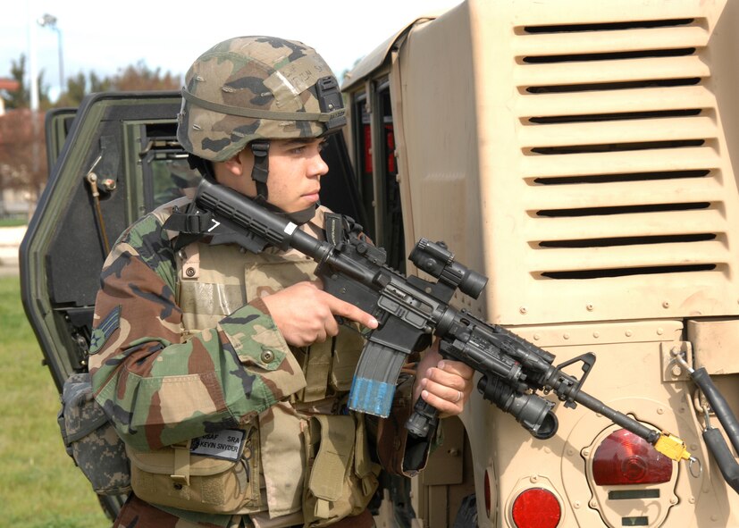 During a demonstration of simulated combat, Senior Airman Kevin Snyder, 572nd Global Mobility Readiness Squadron at Travis Air Force Base, Calif. shows what the Security Forces Flight contributes to the overall mission of Travis. Members of Leadership Vacaville, a local organization that is compiled of members from several businesses in the area, got to see first-hand how Travis team members accomplish their missions.   (U.S. Air Force photo by: Civ/Laura Fentress)