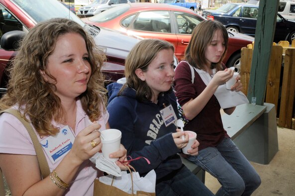 Kimberly Farris and her daughters Amanda and Bethany enjoy some complimentary ice cream in Plains. The favorite flavor of the day was peanut butter. U. S. Air Force photo by Sue Sapp