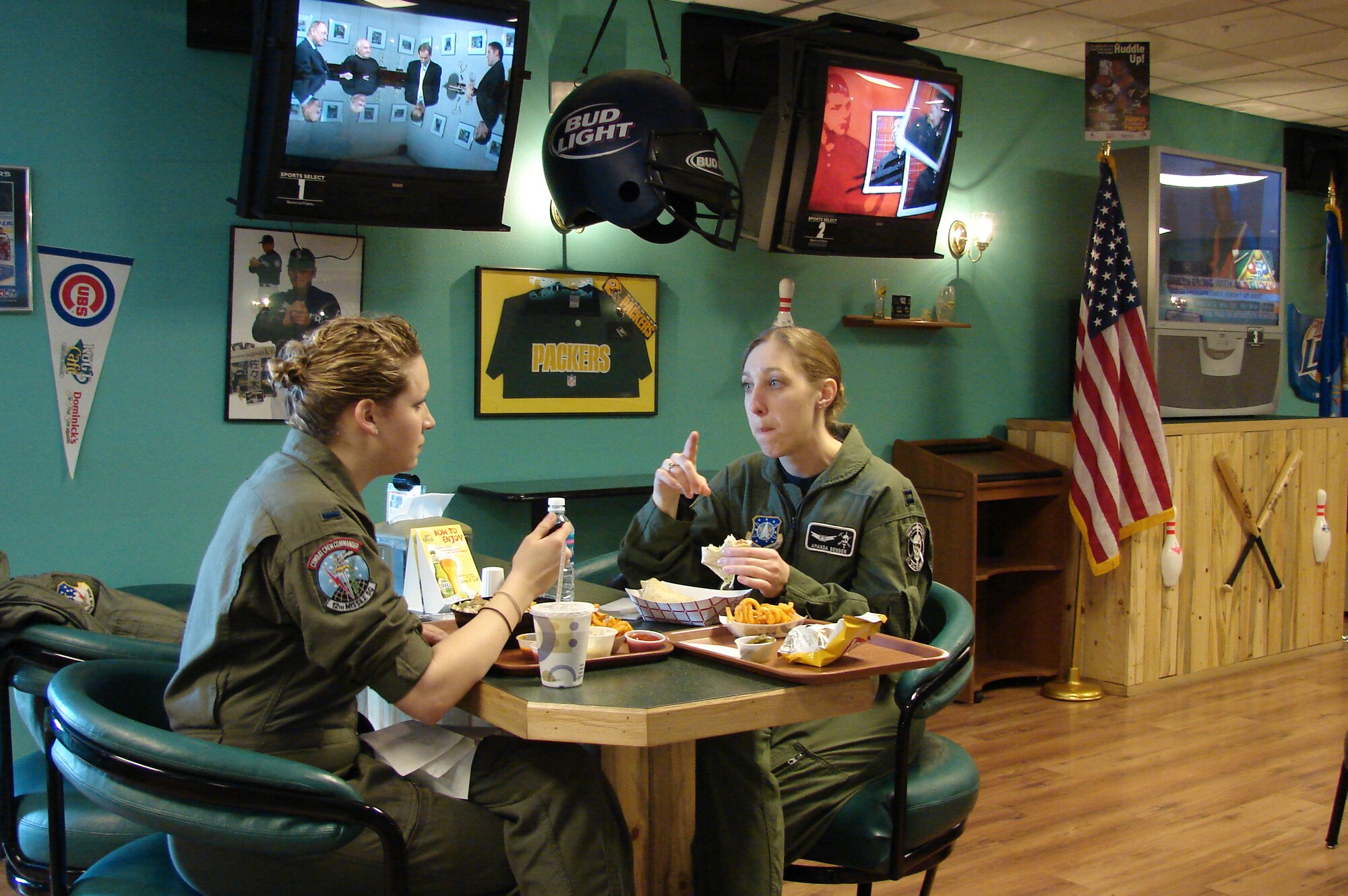1st Lt. Naomi Haines and Capt. Amada Beard, 341st Operations Group, eat lunch in the Strike Zone at the Aces High Bowling Center. The Services Squadron will be evaluated for the Air Force-level Maj. Gen. Eugene L. Eubank Award April 7 to 11.  (U.S. Air Force Photo/2nd Lt. Korry Leverett)