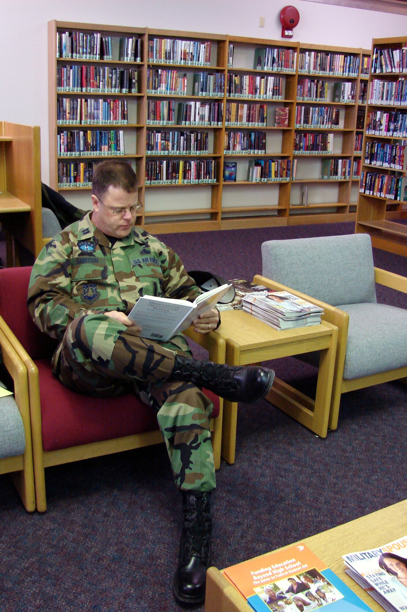 Capt. John Garrison, 341st Maintenance Operations Squadron, reads a book at the Ardin G. Hill Memorial Library.  The Services Squadron will be evaluated for the Air Force-level Maj. Gen. Eugene L. Eubank Award April 7 to 11.  (U.S. Air Force Photo/2nd Lt. Korry Leverett)