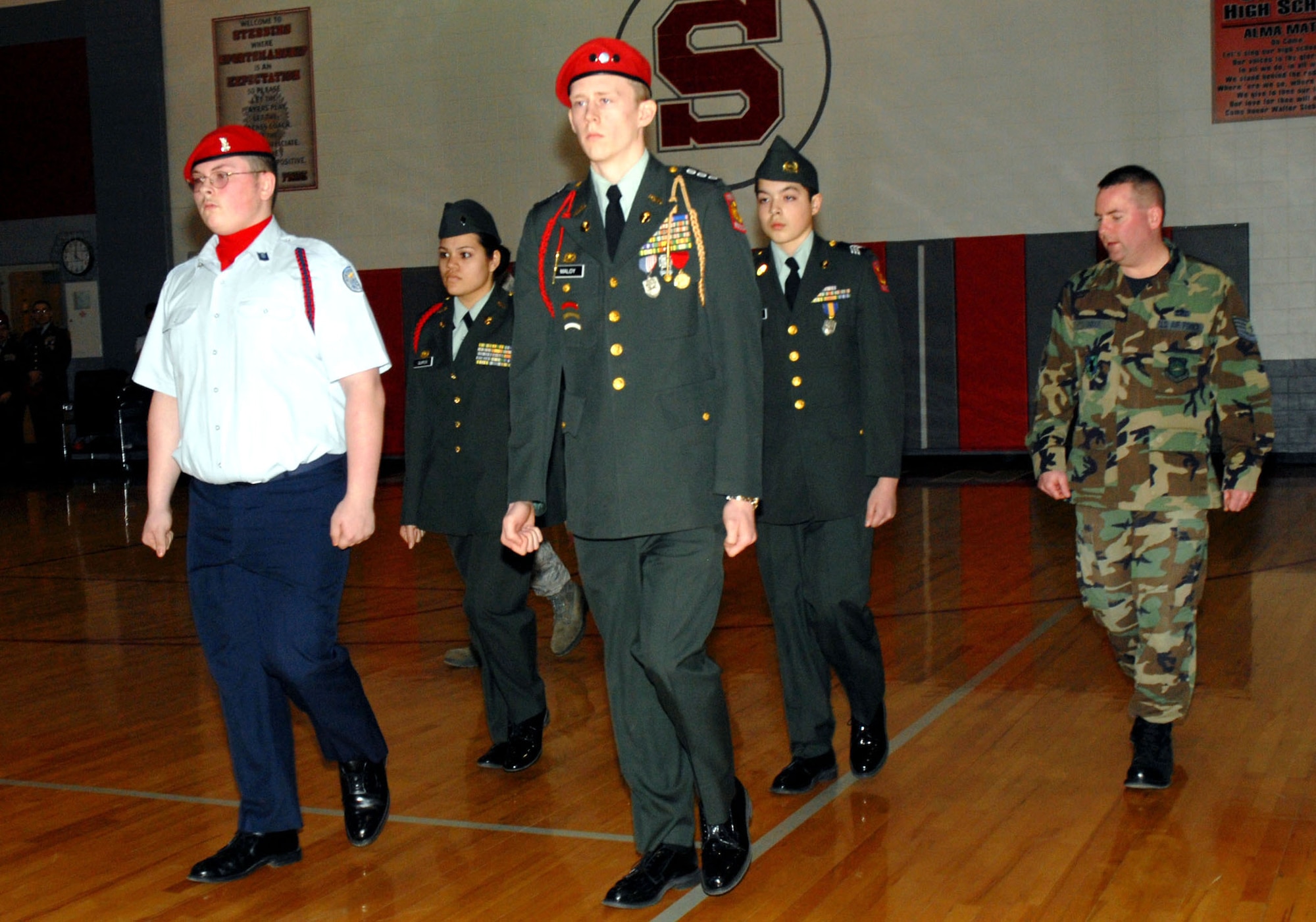 Tech. Sgt. Billie E. Hodge watches for any incorrect drill movements during the unarmed knockout competition at a junior ROTC drill team championships held March 29 at Walter E. Stebbins High School in Riverside, Ohio. Sergeant Hodge is the president of the National Air and Space Intelligence Center's Top IV Association from Wright-Patterson Air Force Base, Ohio. (U.S. Air Force photo/Master Sgt. Bonnie A. White)