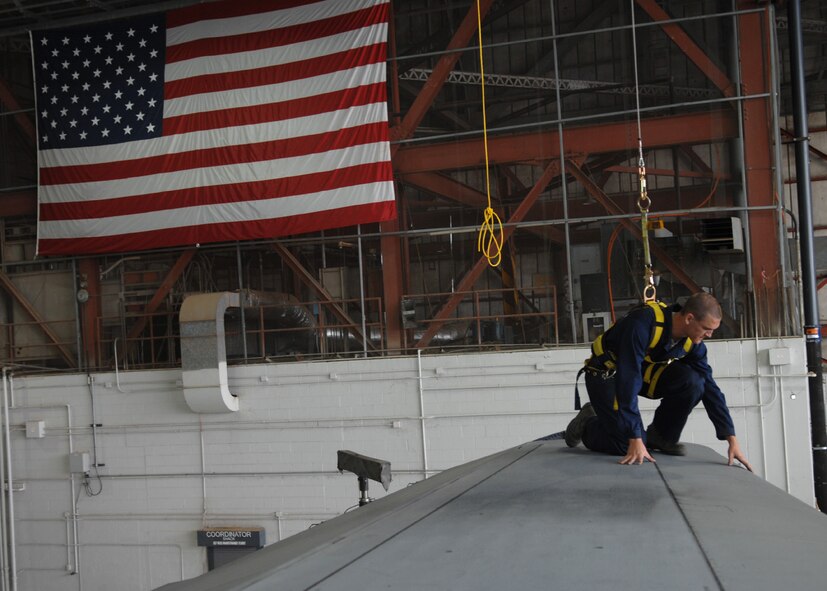 DYESS AIR FORCE BASE, Texas -- Airman 1st Class Seth Duggan inspects the leading edge of a C-130, April 2. Part of being a crew chief is cleaning out an aircraft after ever mission, and to inspects everything down to the smallest rivets and cracks. (U.S. Air Force photo Airman 1st Class Jennifer Romig)