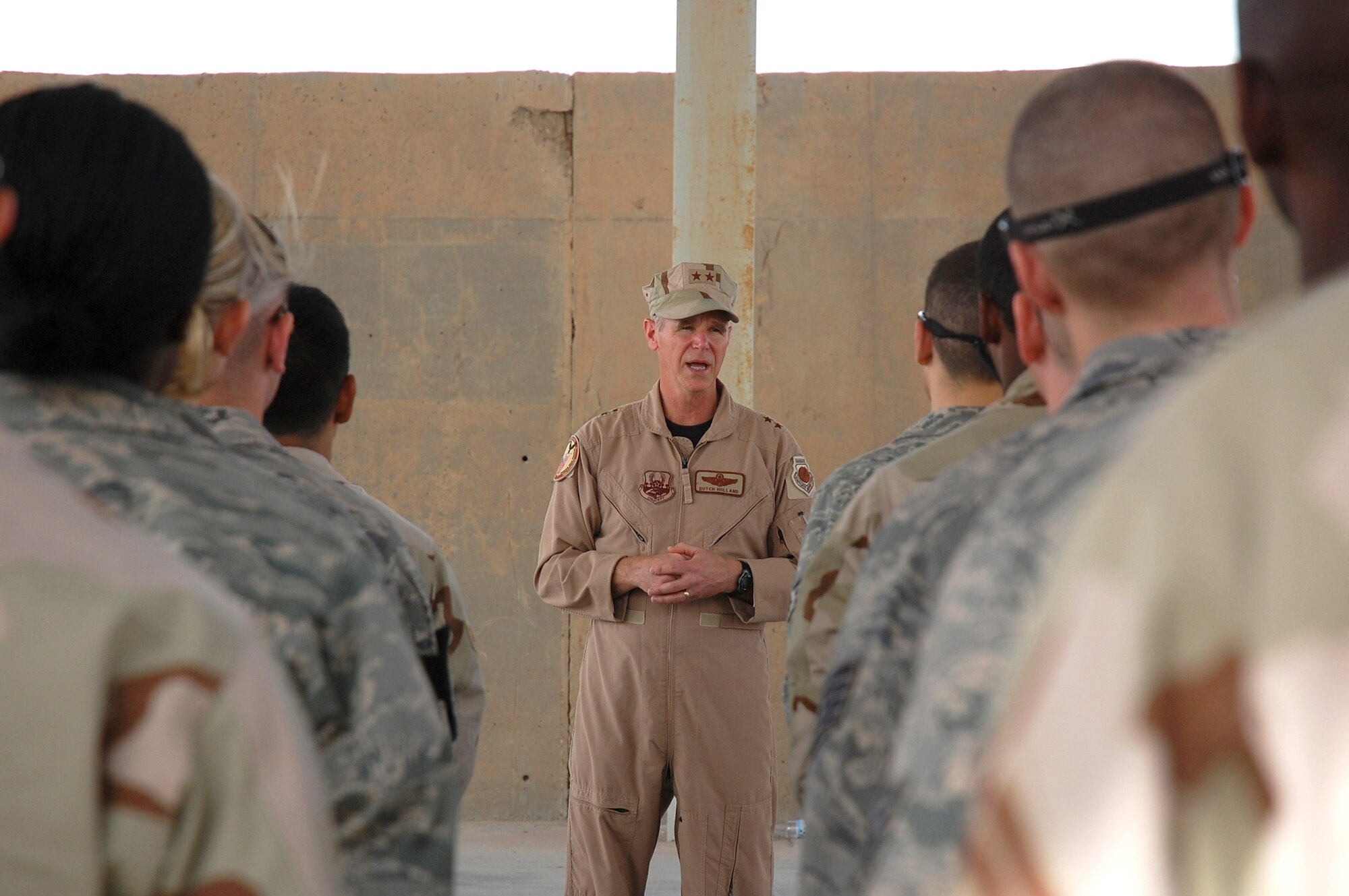SOUTHWEST ASIA -- Major Gen. William Holland, Vice Commander, 9th Air Force, and Deputy Commander, U.S. Central Command Air Forces, Shaw Air Force Base, S.C., talks to members from the 386th Expeditionary Maintenance Group April 2, 2008, during a visit to an air base in the Persian Gulf Region. General Holland visited the area of responsibility to thank the Airmen for what they do and to take back any inputs on how to better train and equip the Airmen supporting Operations Iraqi and Enduring Freedom. (U.S. Air Force photo/ Staff Sgt. Patrick Dixon)