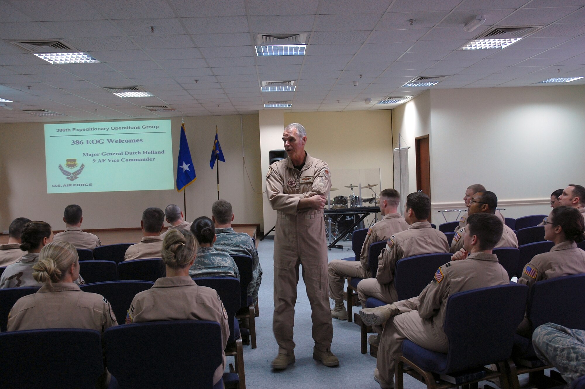 SOUTHWEST ASIA -- Major Gen. William Holland, Vice Commander, 9th Air Force, and Deputy Commander, U.S. Central Command Air Forces, Shaw Air Force Base, S.C., speaks with members from the 386th Expeditionary Operations Group April 2, 2008, during a visit to an air base in the Persian Gulf Region. General Holland visited the area of responsibility to thank the Airmen for what they do and to take back any inputs on how to better train and equip the Airmen supporting Operations Iraqi and Enduring Freedom. (U.S. Air Force photo/ Staff Sgt. Patrick Dixon)