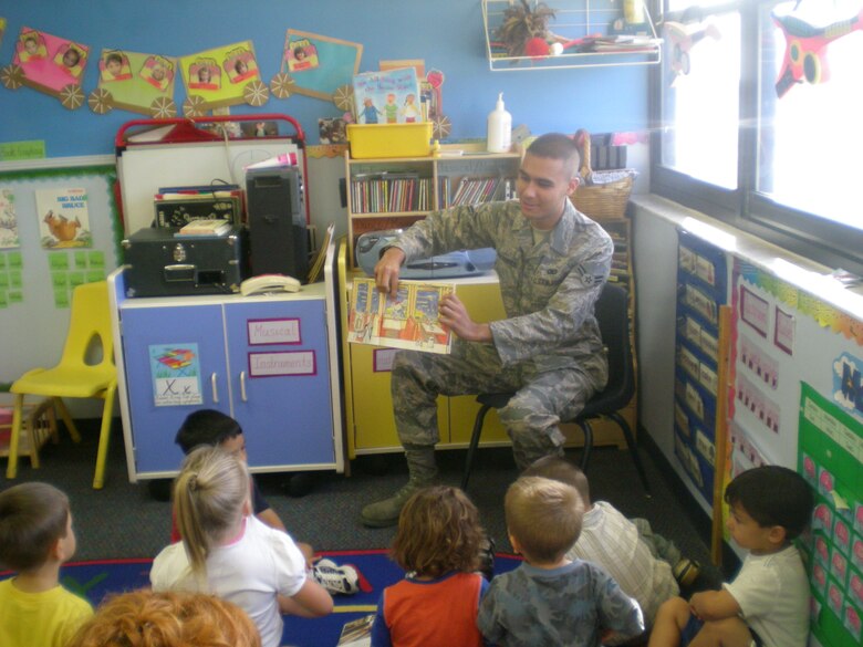 Airman 1st Class Gary Patterson from the 45th Security Forces Squadron reads a book to pre-school children as part of a community involvement effort created by the First Term Airmen Course.  The three and four-year-old children were thrilled to have a visitor come to their class. (U.S. Air Force photo by Tech. Sgt. Lisa Luse')