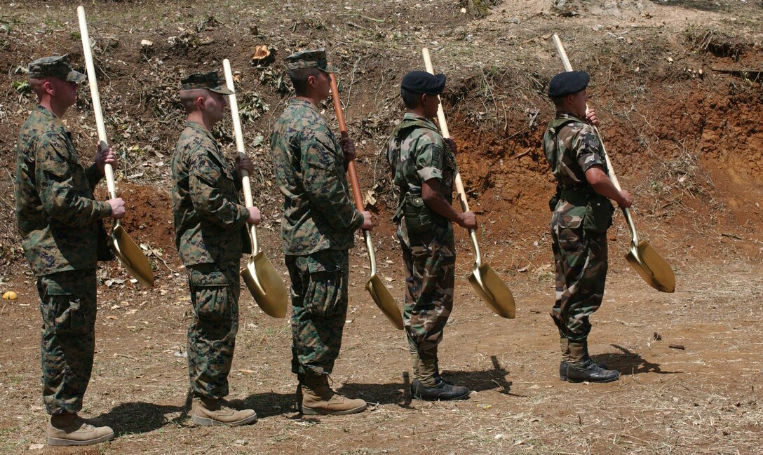 Three U. S. Marines and two Honduran soldiers prepare to march to a ceremonial earth breaking event at the opening ceremony for Beyond the Horizon 08 on April 1.