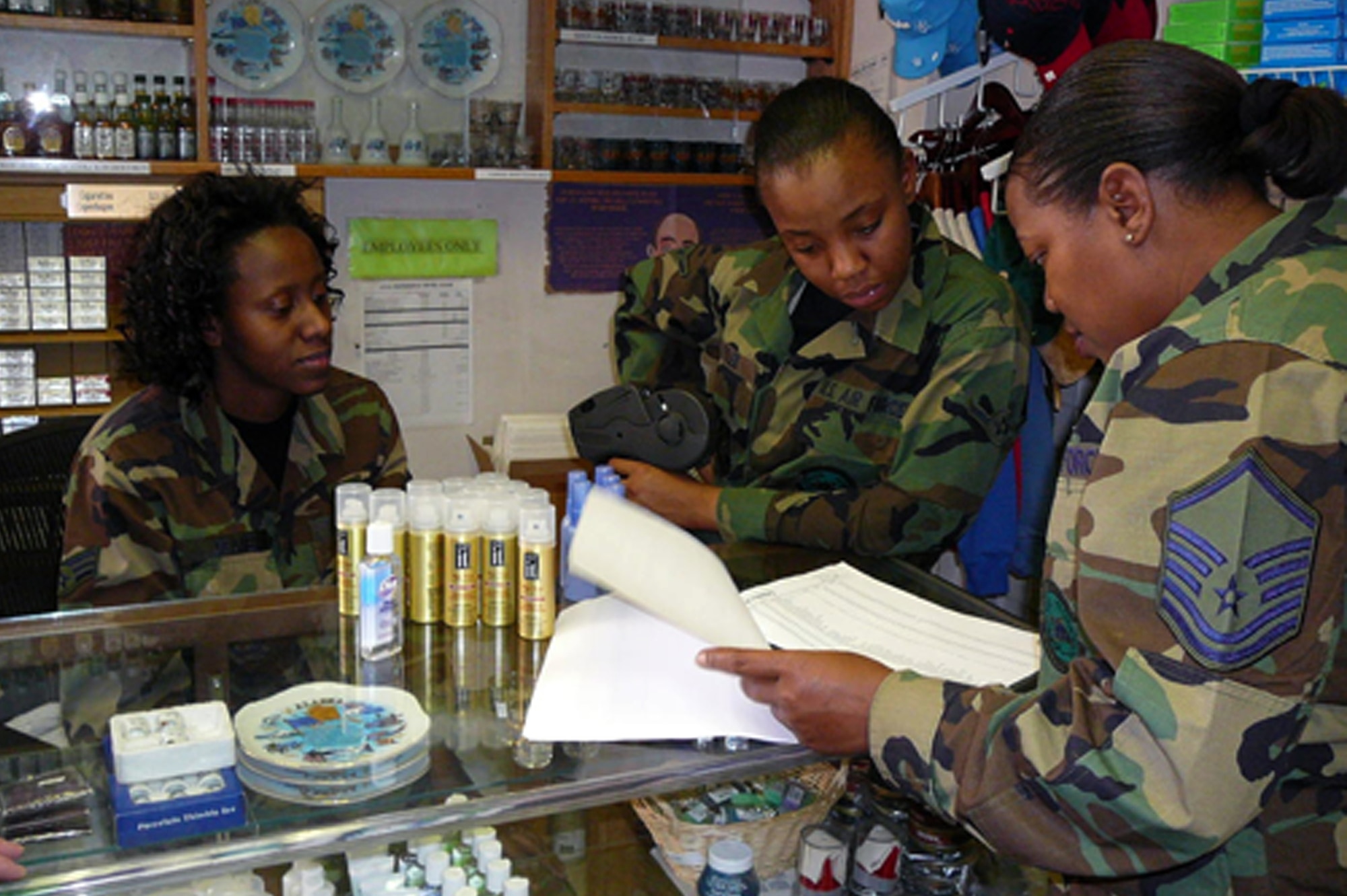 Master Sergeant Antoinette Worthey, 512th Memorial Affairs Squadron NCO in charge of plans and programming, conducts a training session with Senior Airman Tanasha Deanes, 512th MAS front office representative, and AirmanTiara Tyle, 512th MAS lodging front desk clerk, while performing annual tour at Elmendorf Air Force Base, Ala. Customer focus and satisfaction is one of the four areas considered when units are regarded for the top Readiness Program in the Air Force Reserve Command, which the 512th MAS was recently awarded. (U.S. Air Force courtesy photo)