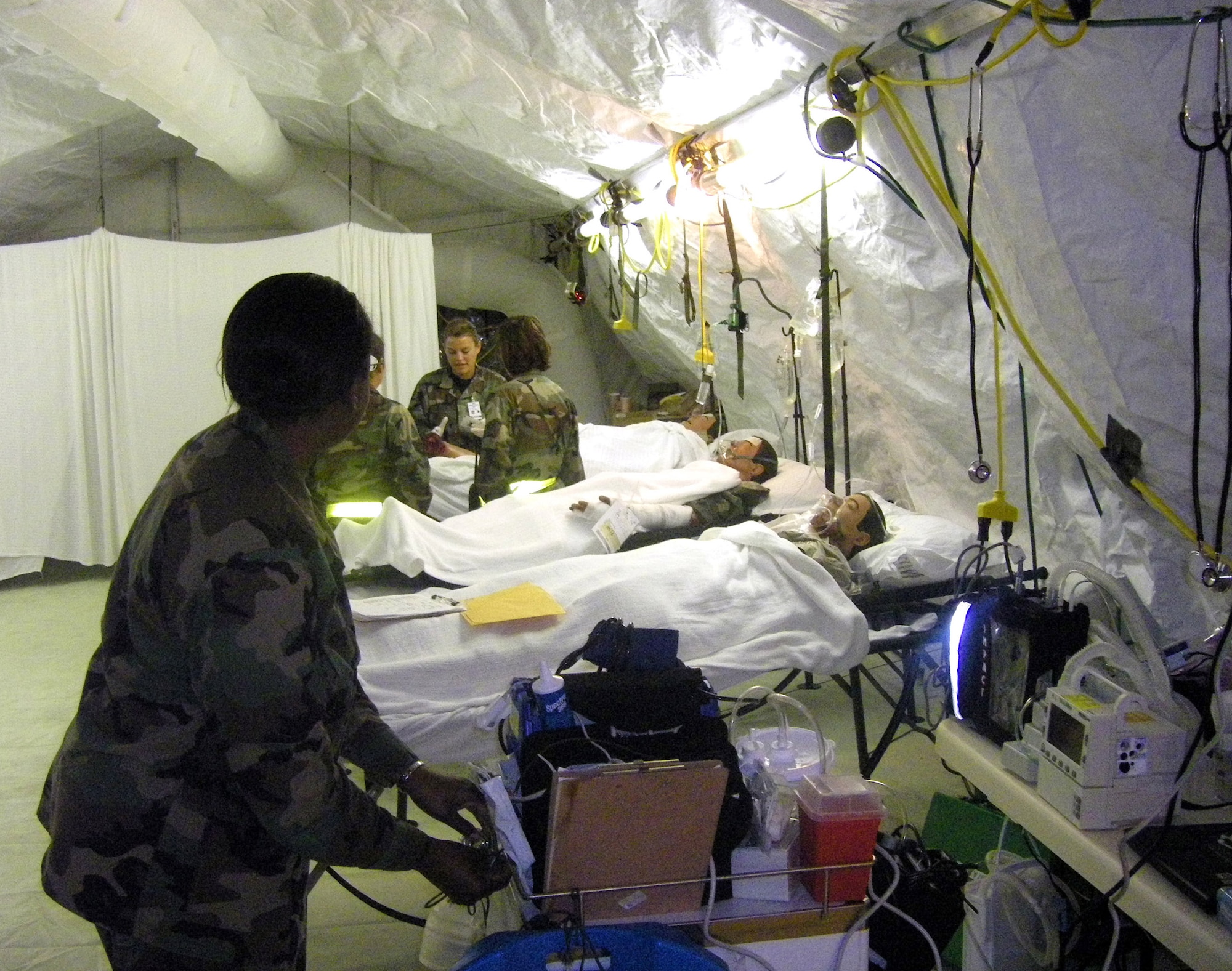 Contingency Aeromedical Staging Facility personnel care for simulated patients Feb. 2 during the Pacific Lifeline 2008 exercise in Hawaii. The medical members were evaluated durnig the exercise after attending the 381st Training Squadron's CASF Mobile Training Course. The Sheppard Air Force Base, Texas, training couse is the first of its type to be certified by both Air Education and Training Command and Air Mobility Command, and can now be taught worldwide. (U.S. Air Force photo) 