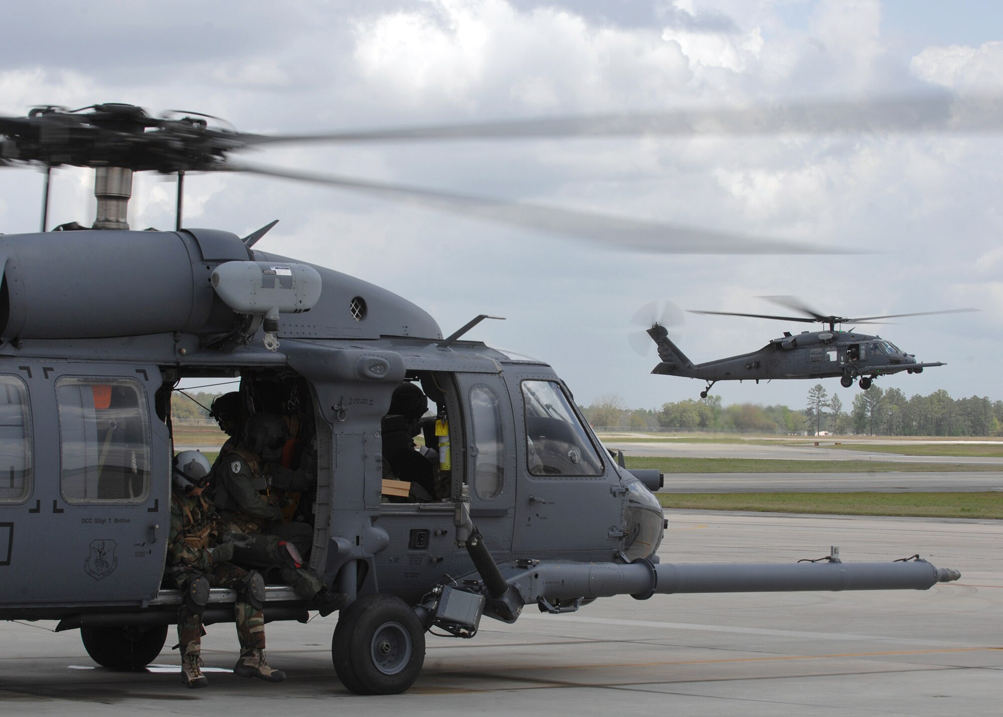 Airmen prepare for a flight on an HH-60G Pave Hawk April 1 at Moody Air Force Base, Ga.  The HH-60G is a twin-engine medium-lift helicopter used in combat search and rescue missions. (U.S. Air Force photo/Airman 1st Class Brittany Barker)