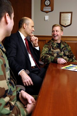 Brig. Gen. Pete Hoene, 350th Electronic Systems Wing commander, talks to Tom Powis, 350 ELSW deputy director, and Capt. Edward Wagner, the wing’s executive officer, during a recent meeting. This week General Hoene will leave Hanscom and the 350 ELSW to move to his new post as the Defense Information Systems Agency Joint Program Executive Officer for Command and Control.  (U.S. Air Force photo by Mark Wyatt)
