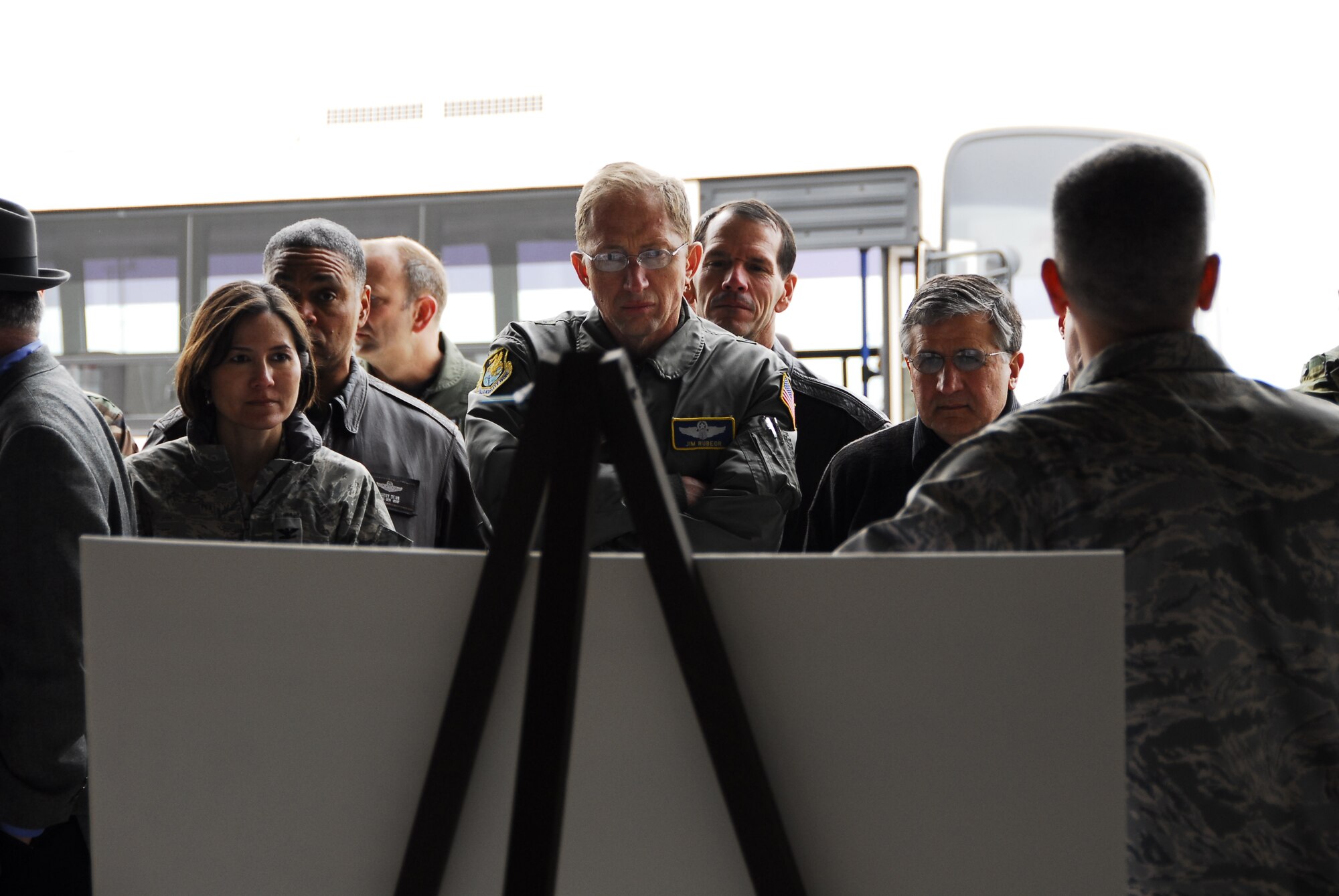 KUNSAN AIR BASE, Republic of Korea -- Air Force Board members look over a story board while being briefed by Col. Timothy Sakulich, 8th Mission Support Group commander, during a visit here April 2.  Board members visited Kunsan for a first- hand look at the base and its mission.  (U.S. Air Force photo/Tech. Sgt. Quinton T. Burris)  


