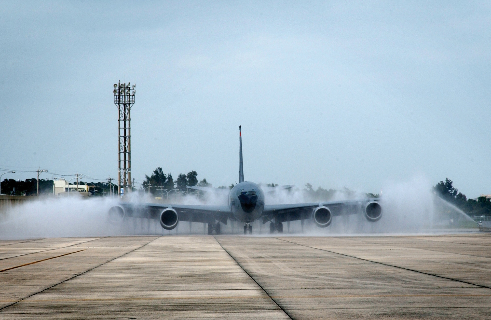 A Kadena KC-135 drives through the wash rack after a mission here, to clean any salt and debris of the fuselage.  The rinse only takes a few seconds but the water causes over spray onto the local residents living near the facility.  The new wash rack will be considerably farther away from the perimeter of the base and be able to better provide support to all the aircraft here.
(U.S. Air Force photo/Senior Airman Jeremy McGuffin) 