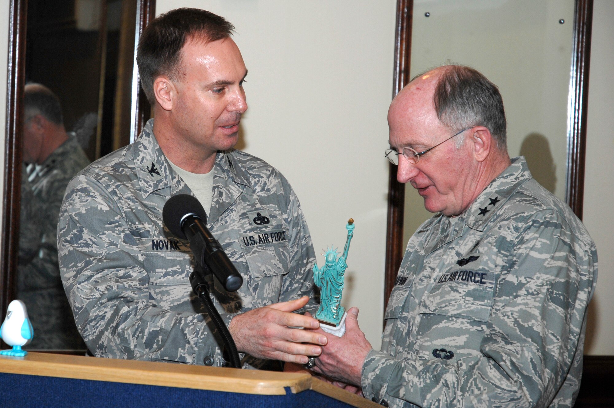 Col. Marcus Novak, 48th Maintenance Group commander presents a Statue of Liberty statue to Chaplain (Maj. Gen.) Charles Baldwin, Air Force Chief of Chaplains, March 27 as a thank you gift from the 48th Fighter Wing for his speech during the National Prayer Breakfast. (U.S. Air Force photo by Senior Airman Brian Ellis)