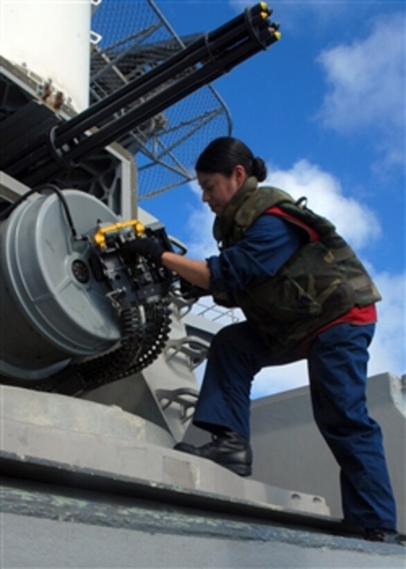 Fire Controlman 2nd Class Sol Benavides loads 20mm ammunition into a Phalanx close-in weapons system aboard the Nimitz-class aircraft carrier USS Abraham Lincoln, April 2, 2008. Lincoln and embarked Carrier Air Wing 2 are on a seven-month deployment to the U.S. 5th Fleet area of responsibility.  