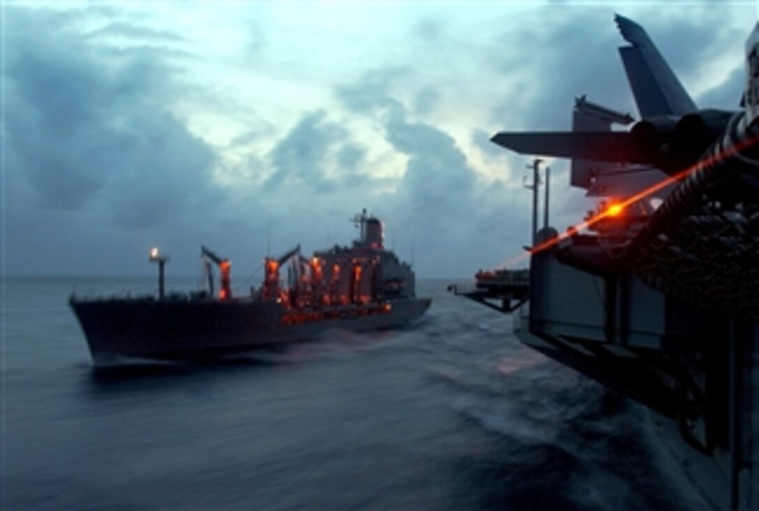 The Military Sealift Command fleet replenishment oiler USNS Laramie pulls alongside the aircraft carrier USS Theodore Roosevelt during a replenishment at sea during a tailored ship's training availability and final evaluation problem, April 1, 2008. 