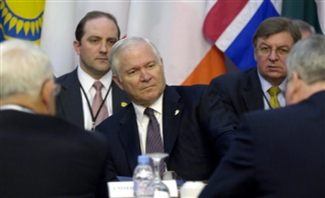 Defense Secretary Robert M. Gates listens to comments during a breakout session at the Bucharest NATO Summit, Romania, April 3, 2008.  