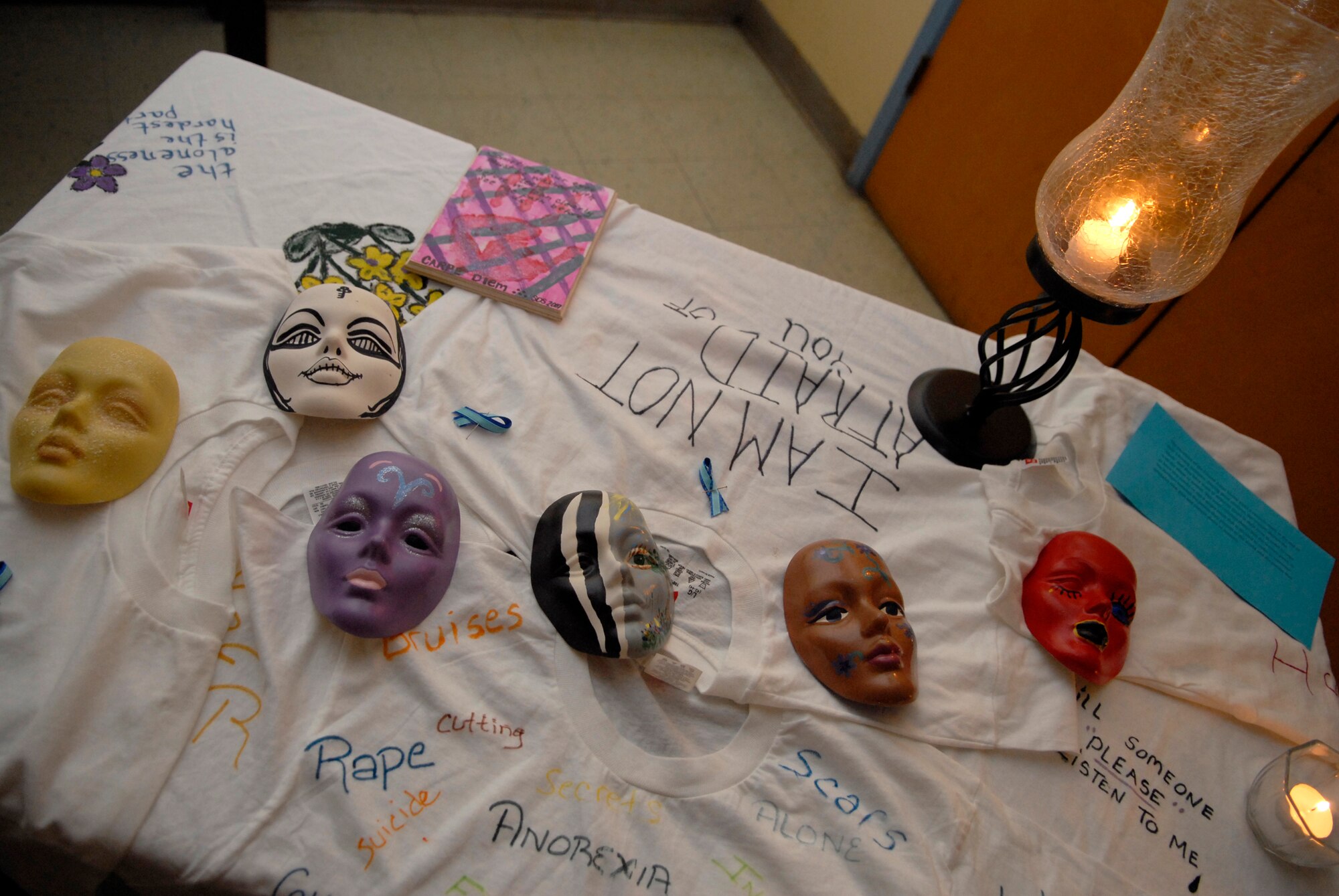 LOMPOC, Calif. -- Masks, candles, and T-shirts are used to remember sexual assault survivors during the 11th annual North County Rape Crisis and Child Protection Center candlelight vigil on April 1. The vigil is to honor the survivors of sexual assault and to prevent future assaults through awareness. The North County Rape Crisis and Child Protection Center was established in 1974 and has been providing care to Vandenberg ever since. (U.S. Air Force photo/Airman 1st Class Christian Thomas) 