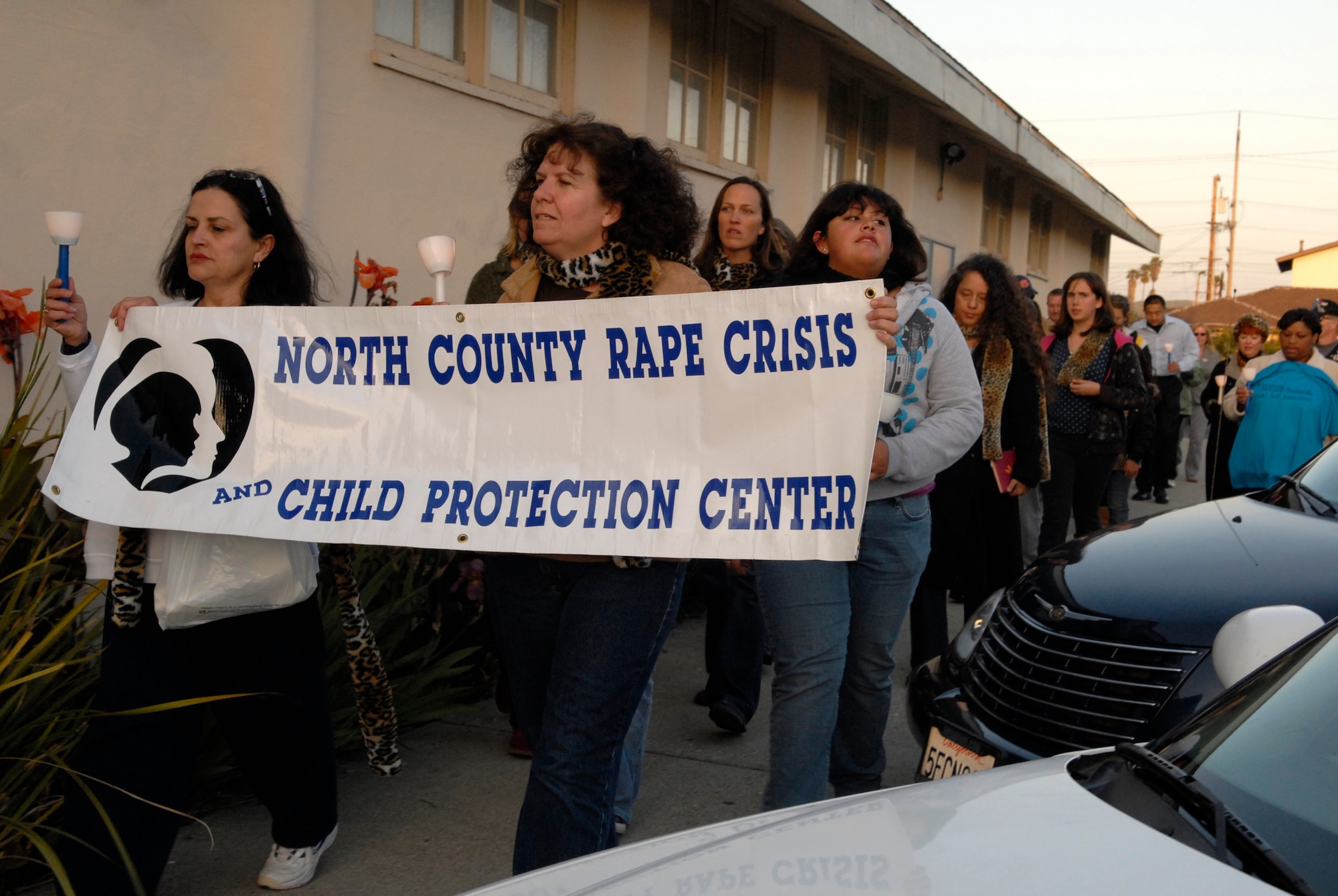 LOMPOC, Calif. -- Airmen and civilian volunteers take a 1 mile walk to remember sexual assault survivors during the 11th annual North County Rape Crisis and Child Protection Center candlelight vigil on April 1. The vigil is to honor the survivors of sexual assault and to prevent future assaults through awareness. The North County Rape Crisis and Child Protection Center was established in 1974 and has been providing care to Vandenberg ever since. (U.S. Air Force photo/Airman 1st Class Christian Thomas) 
