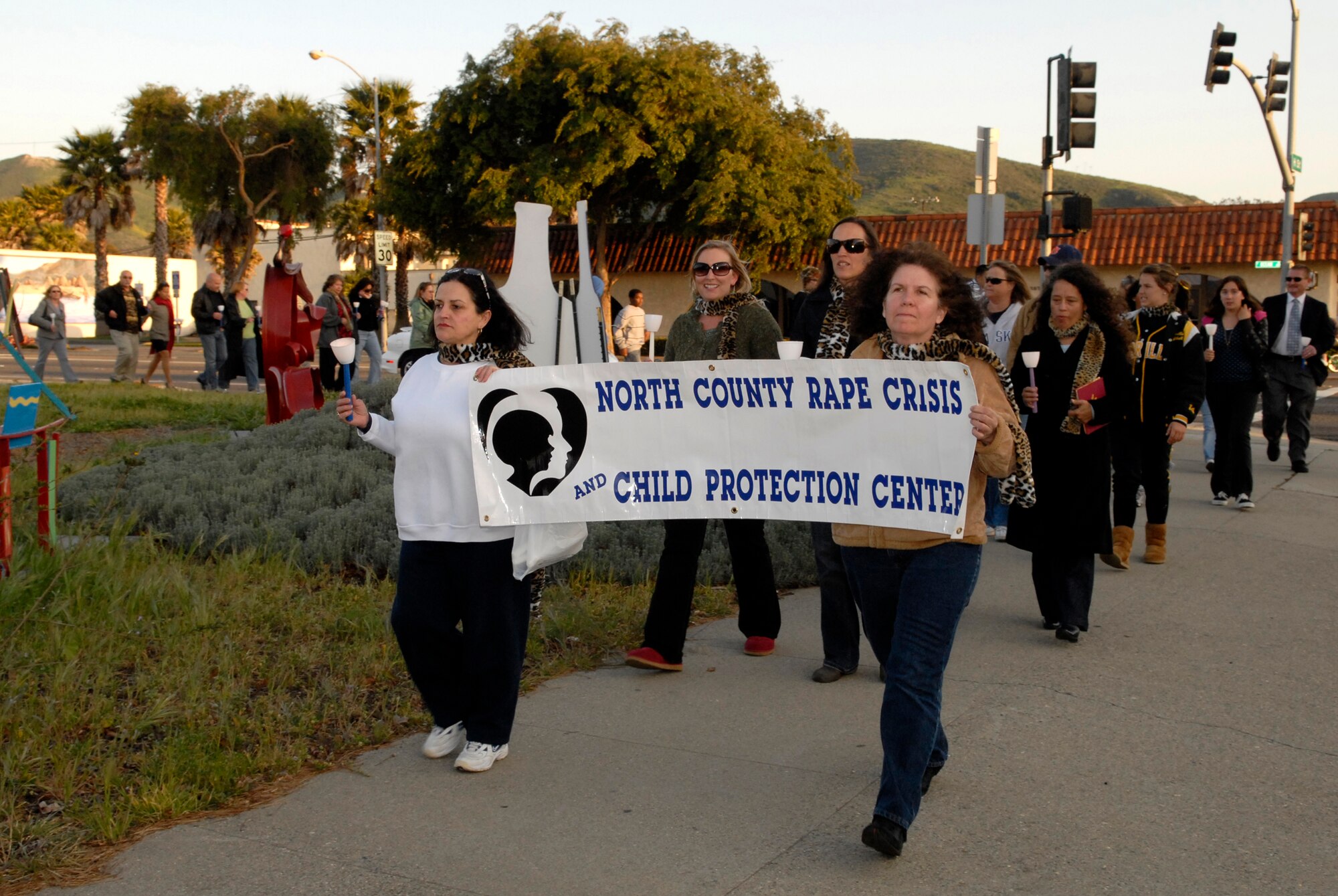 LOMPOC, Calif. -- Airmen and civilian volunteers take a 1 mile walk to remember sexual assault survivors during the 11th annual North County Rape Crisis and Child Protection Center candlelight vigil on April 1. The vigil is to honor the survivors of sexual assault and to prevent future assaults through awareness. The North County Rape Crisis and Child Protection Center was established in 1974 and has been providing care to Vandenberg ever since. (U.S. Air Force photo/Airman 1st Class Christian Thomas) 