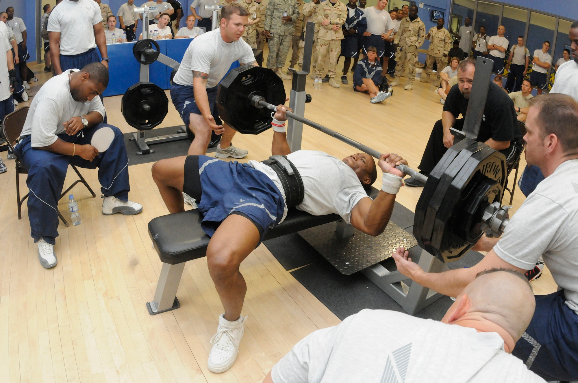 Staff Sgt. Kenyatta Wilson bench presses 350 pounds at the “Strongest in the AOR” competition held at the Blatchford-Preston Fitness Center March 29.  Sergeant Wilson, the 3rd place finisher in the men’s division, was among the 15 competitors from across the installation who came together to see who could bench the most weight. The finalists’ results will be forwarded to Air Forces Central to compete against other installations in the command. (U.S. AIR FORCE PHOTO BY SENIOR AIRMAN DOMONIQUE SIMMONS)